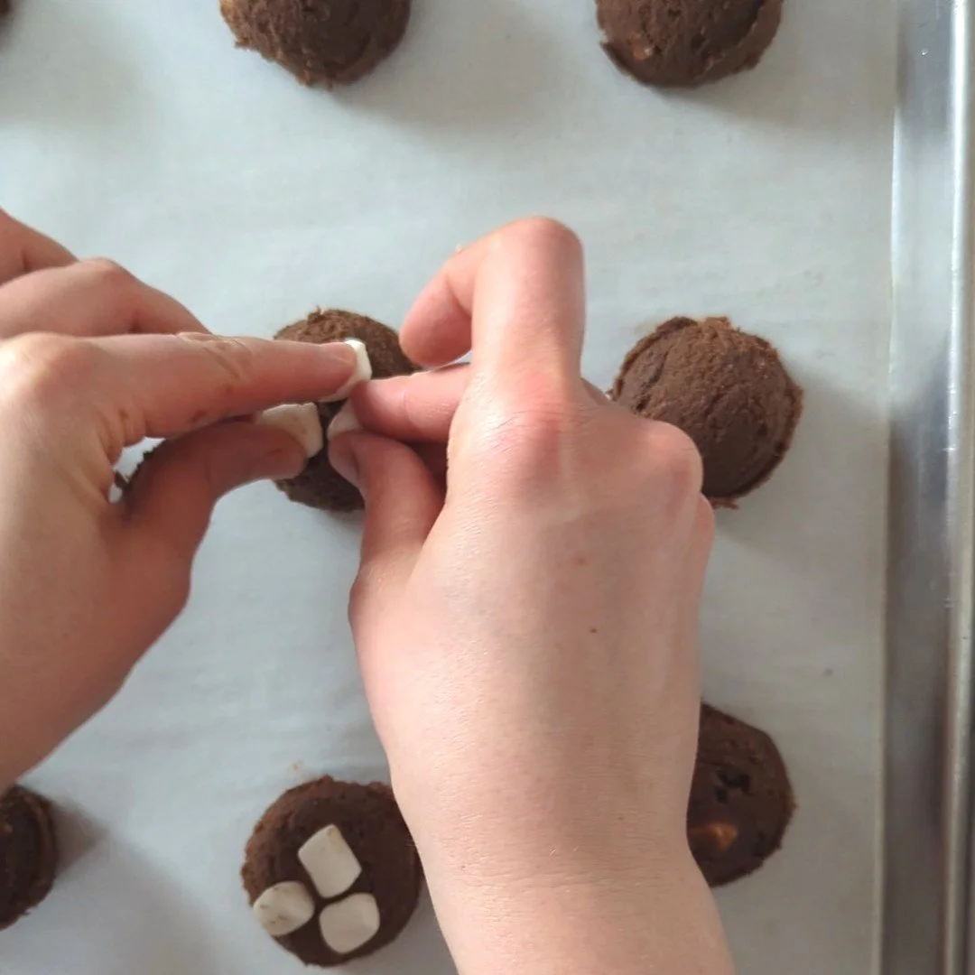 adding marshmallow to hot chocolate cookie dough.jpg