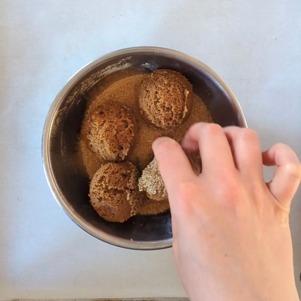 rolling ginger dough in sugar.jpg