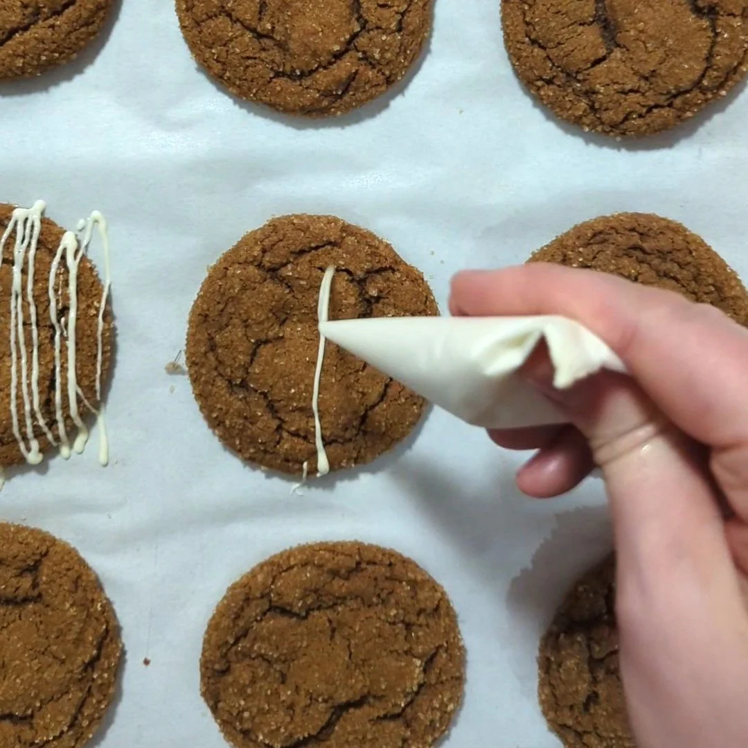 drizzling ginger cookies with chocolate.jpg