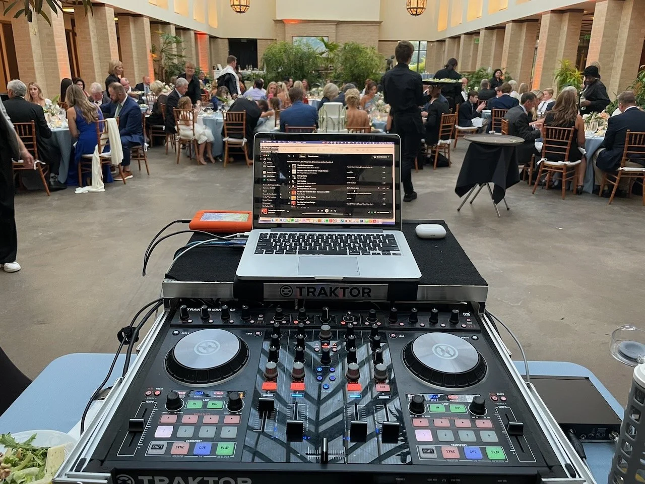 DJ booth set up for a wedding reception in the Floral Display Hall at Lauritzen Gardens in Omaha