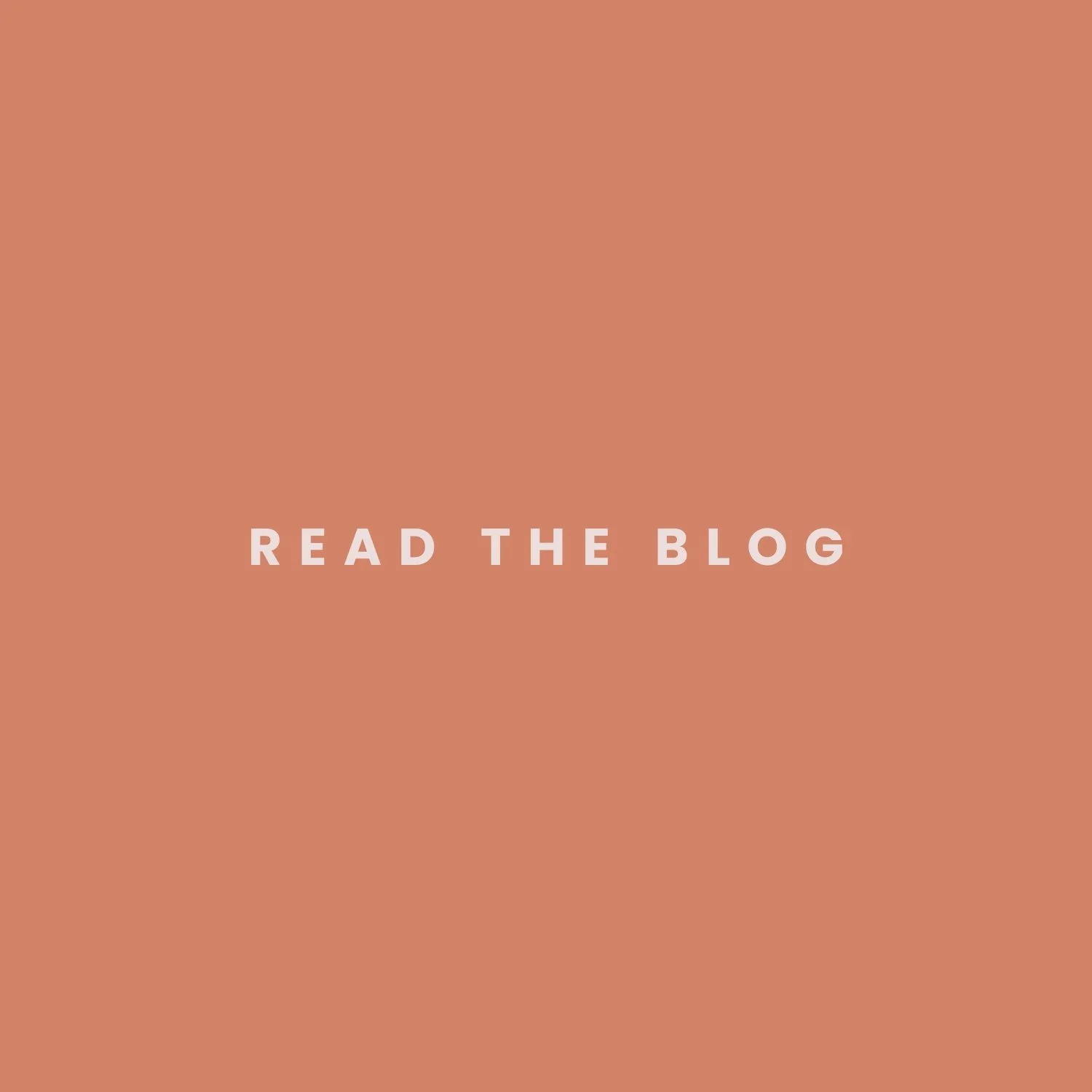 A digital graphic with a peach background and the phrase "READ THE BLOG" in light pink, bold, uppercase letters in the center.