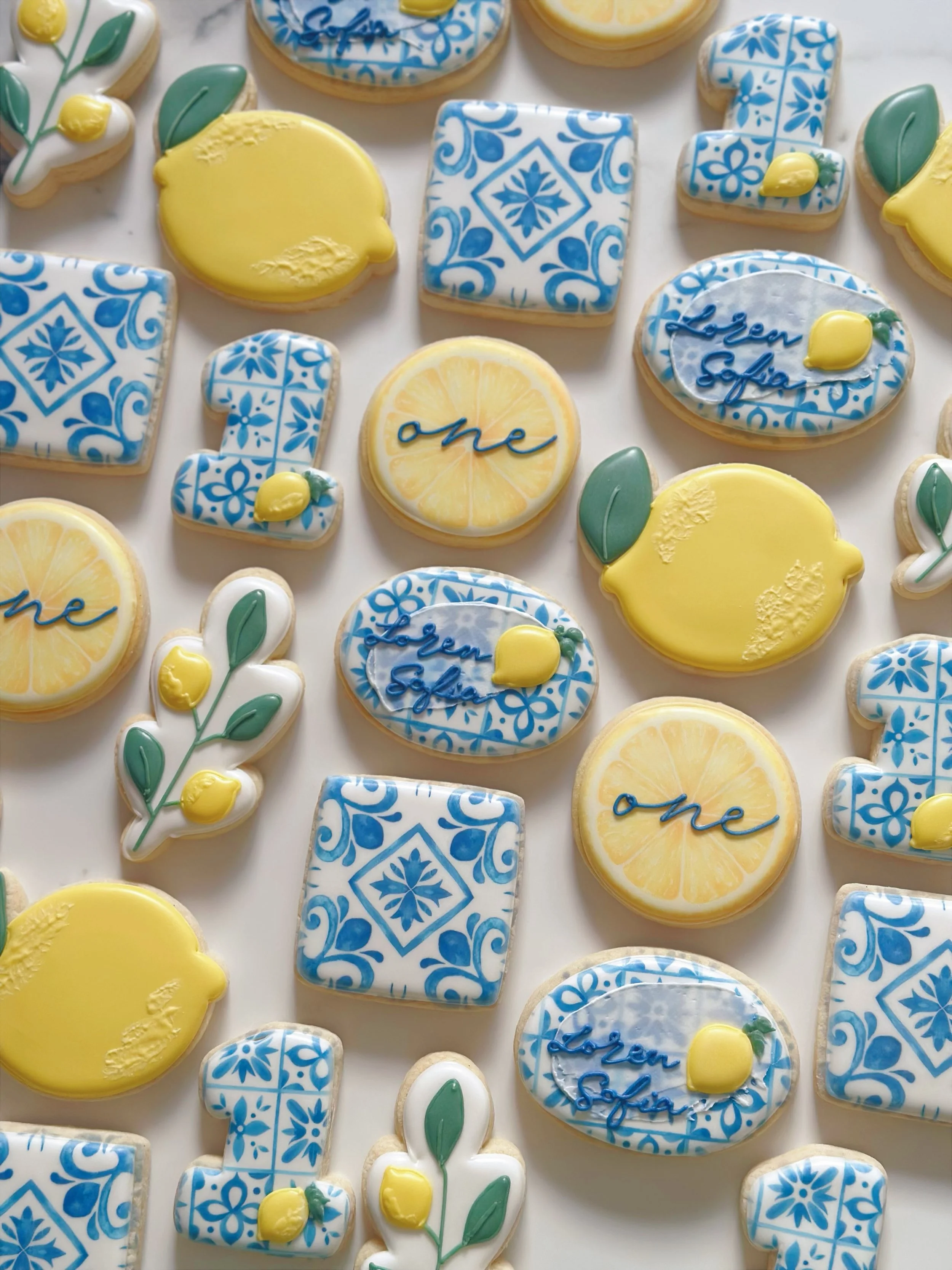 Amalfi Coast themed 1st birthday 🍋 Minis are so hot right now 💁🏻&zwj;♀️

#amalficoastcookies #1stbirthdaycookies #lemonbirthdaycookies #decoratedcookies #sugarcookies