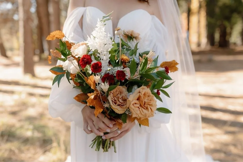 bridal bouquet made of toffee roses, burgundy mini carns, ruskus, and dried nigella, calaveras county wedding florist