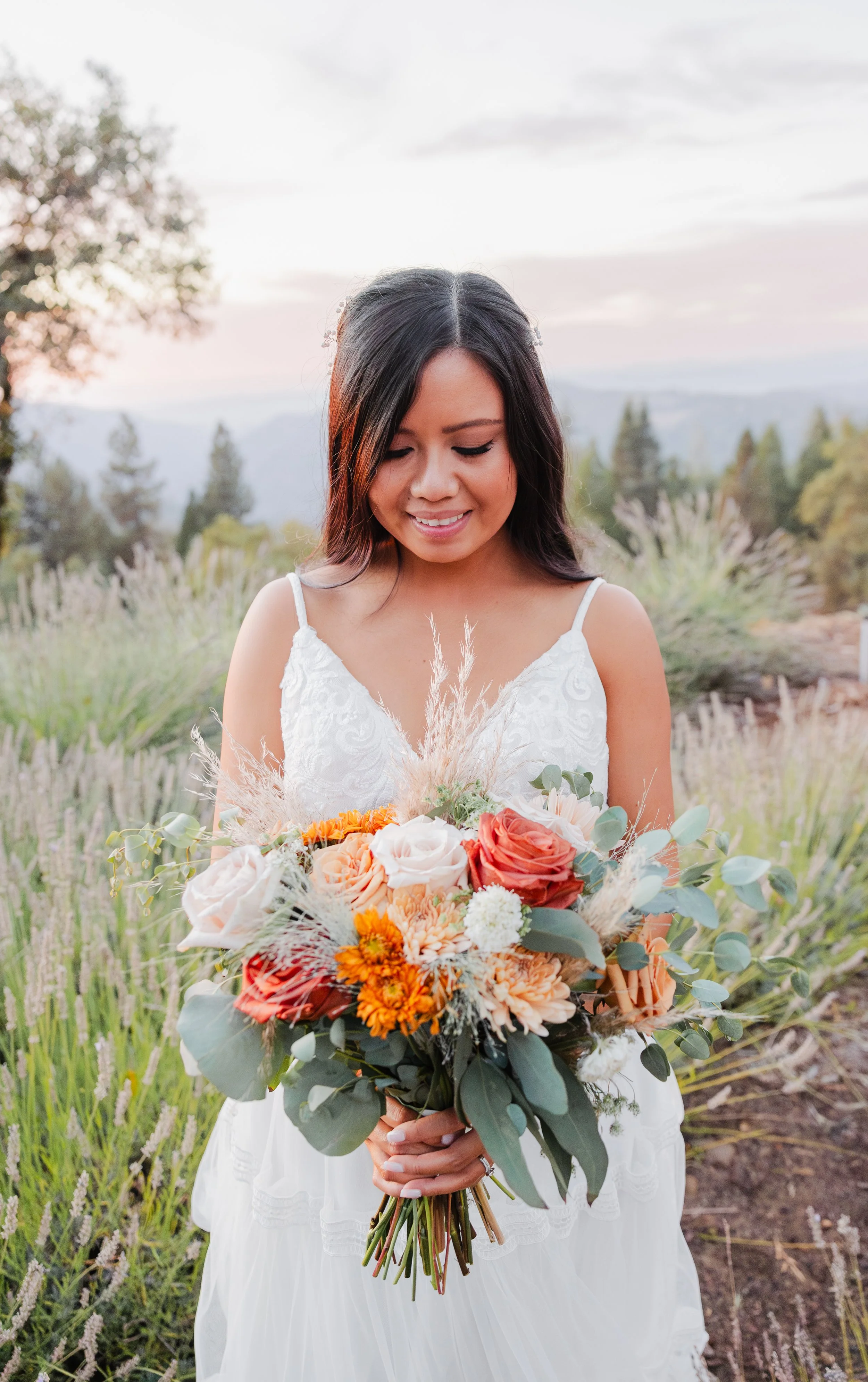 bridal bouquet made of coffee break roses, quicksand roses, bronze mums, eucalyptus, and pampas grass, tuoulmne county wedding flowers