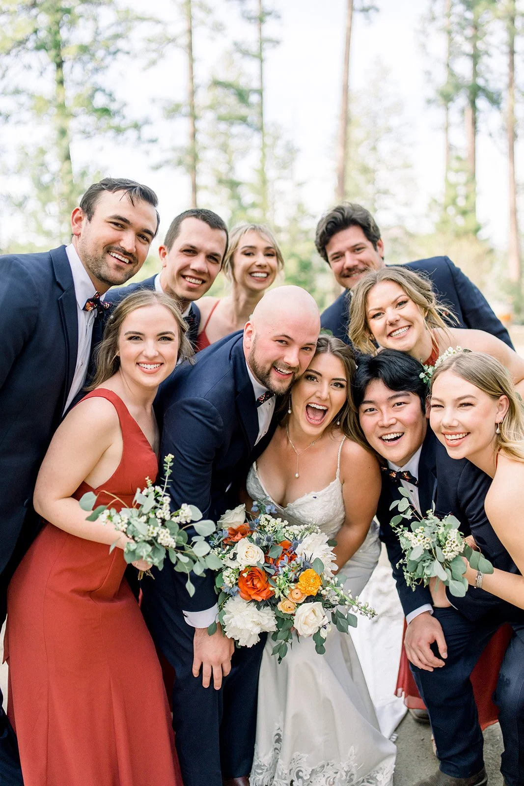 Bridal party smiling together with their bouquets, groveland ca