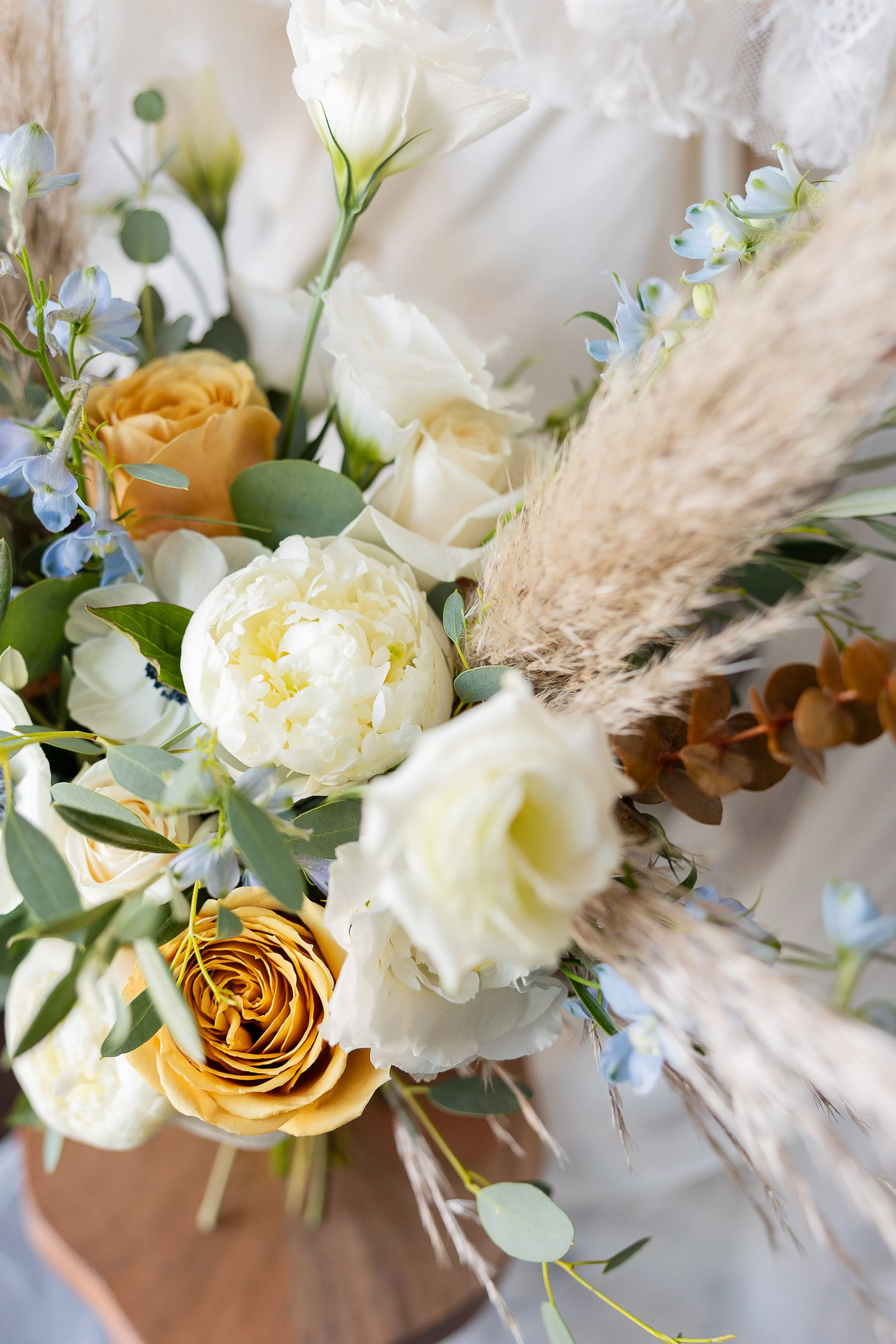 up close of the bridal bouquet showing peonies, toffee roses, pampas grass, and eucalyptus, sonora ca