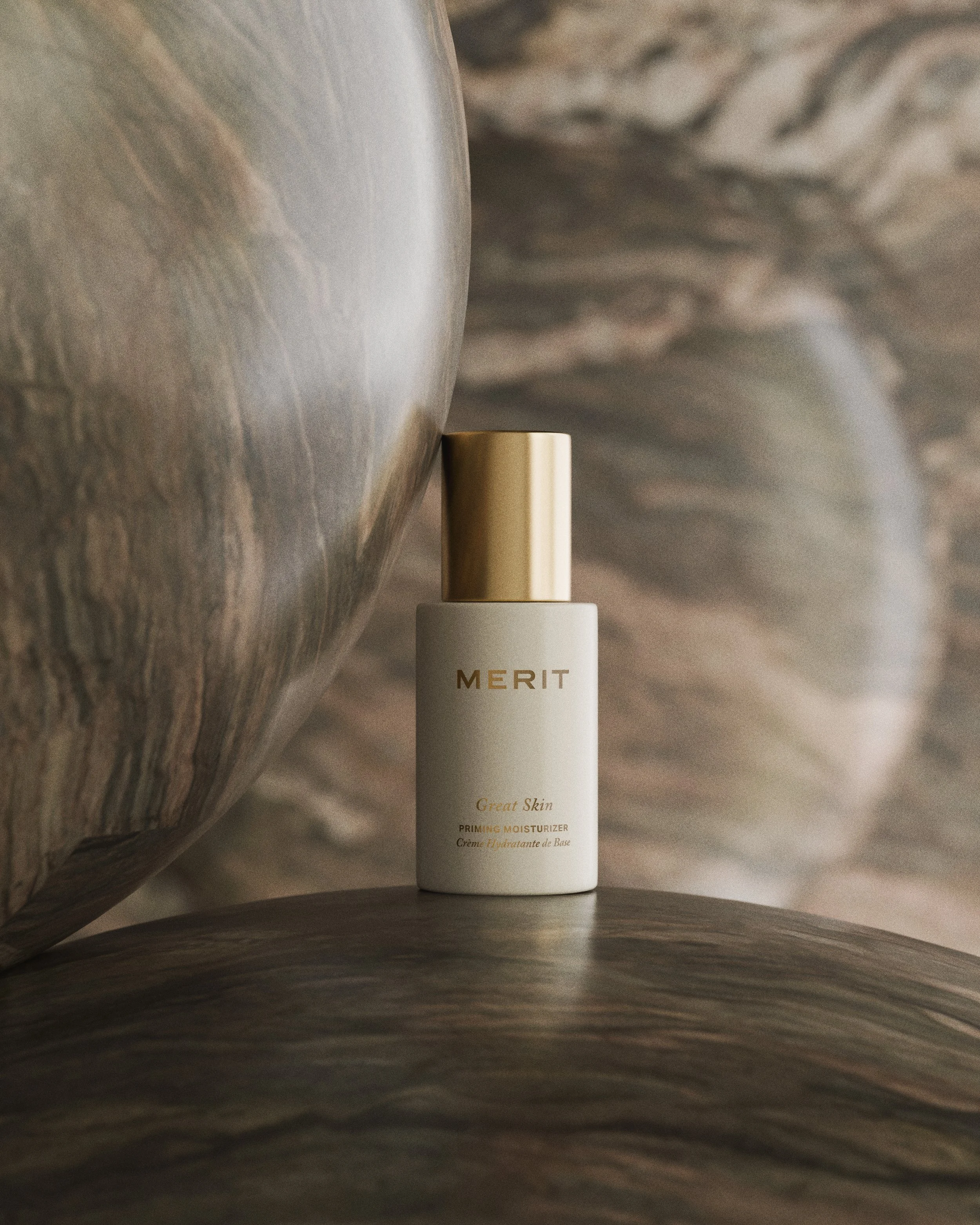 Ultra-photorealistic beauty product photography by Carlos Montelara. Luxury skincare brand imagery for Merit Beauty featuring 'Great Skin' Priming Moisturizer, created via precision CGI at Carlos Montelara Studio in New York City. This high-end edito