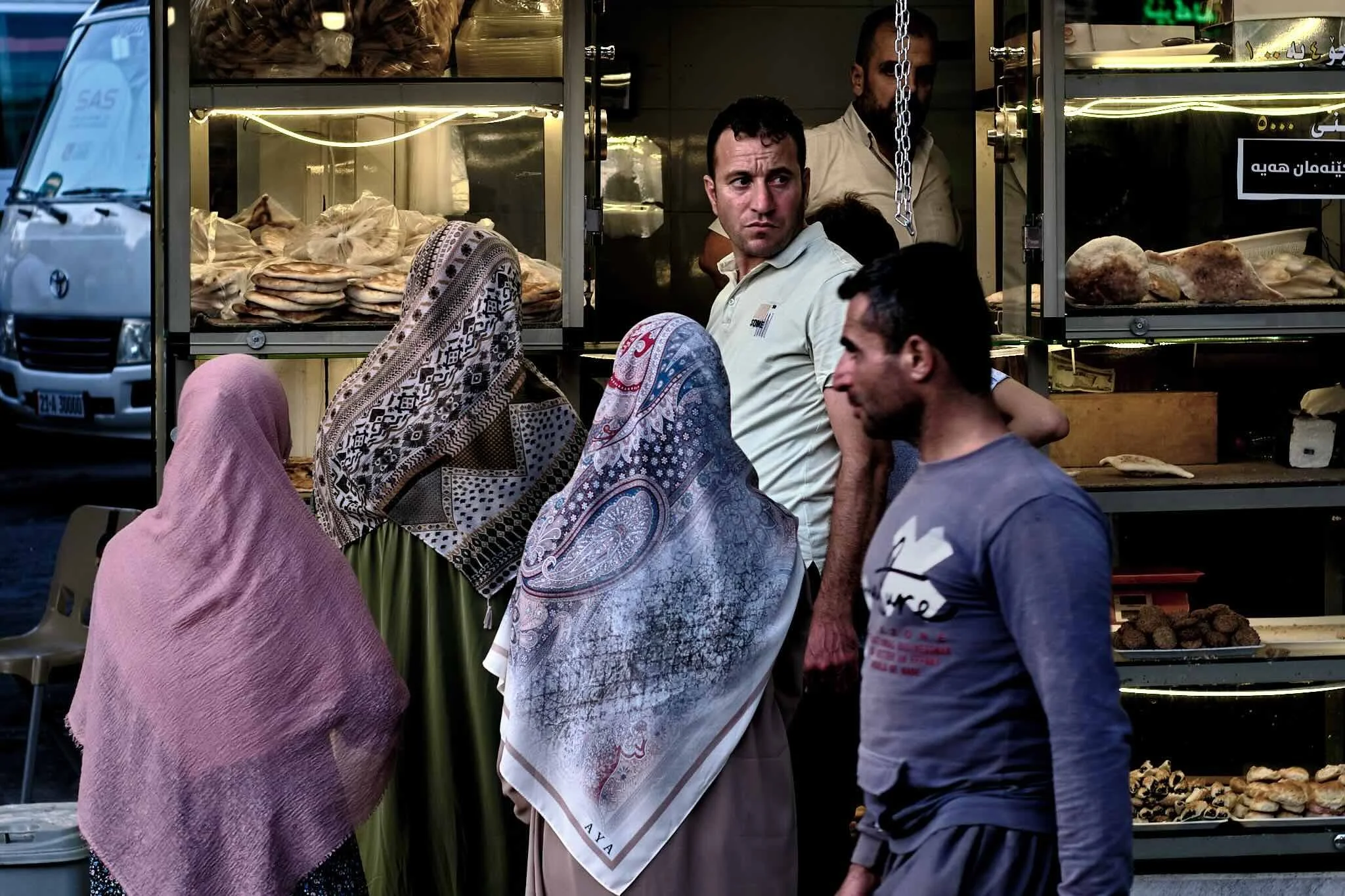 Street photography in Sulaymaniyah Iraq capturing everyday life outside a bakery shop