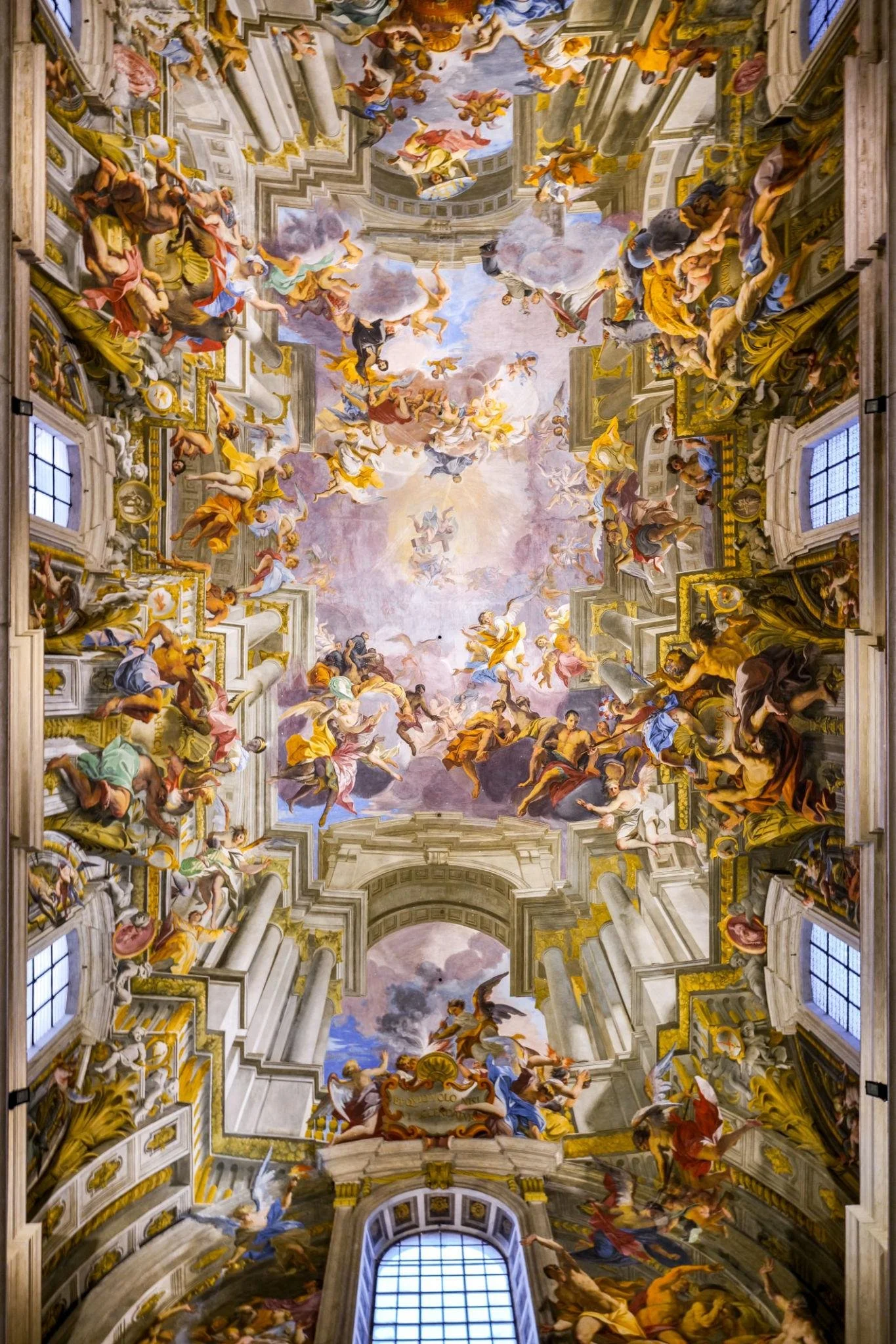Dramatic Baroque ceiling fresco by Correggio, filled with swirling figures, clouds, and illusionistic architecture that opens upward into a luminous painted sky.
