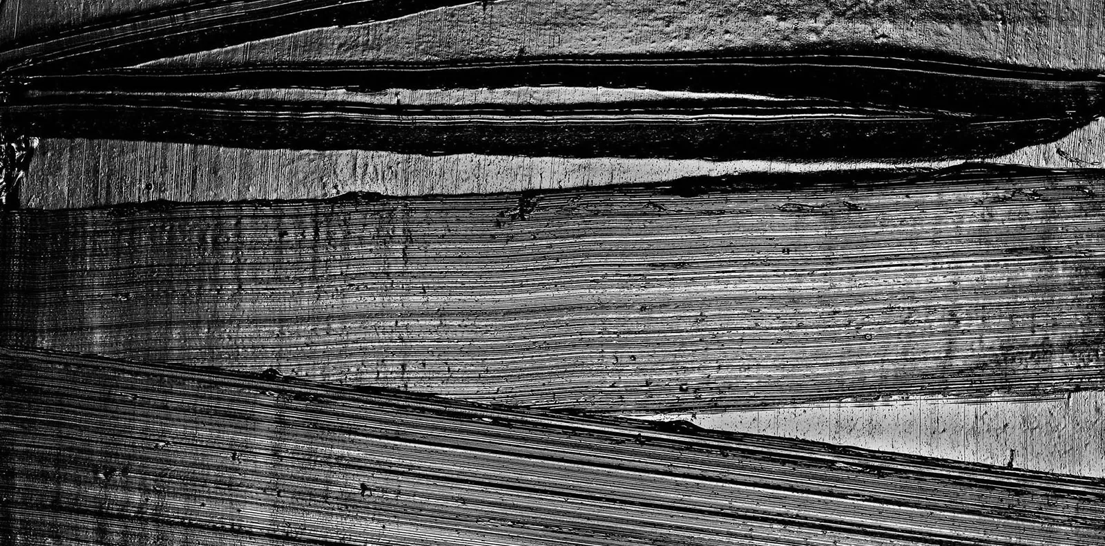 Detail of the texture made by scrapping through black paint.