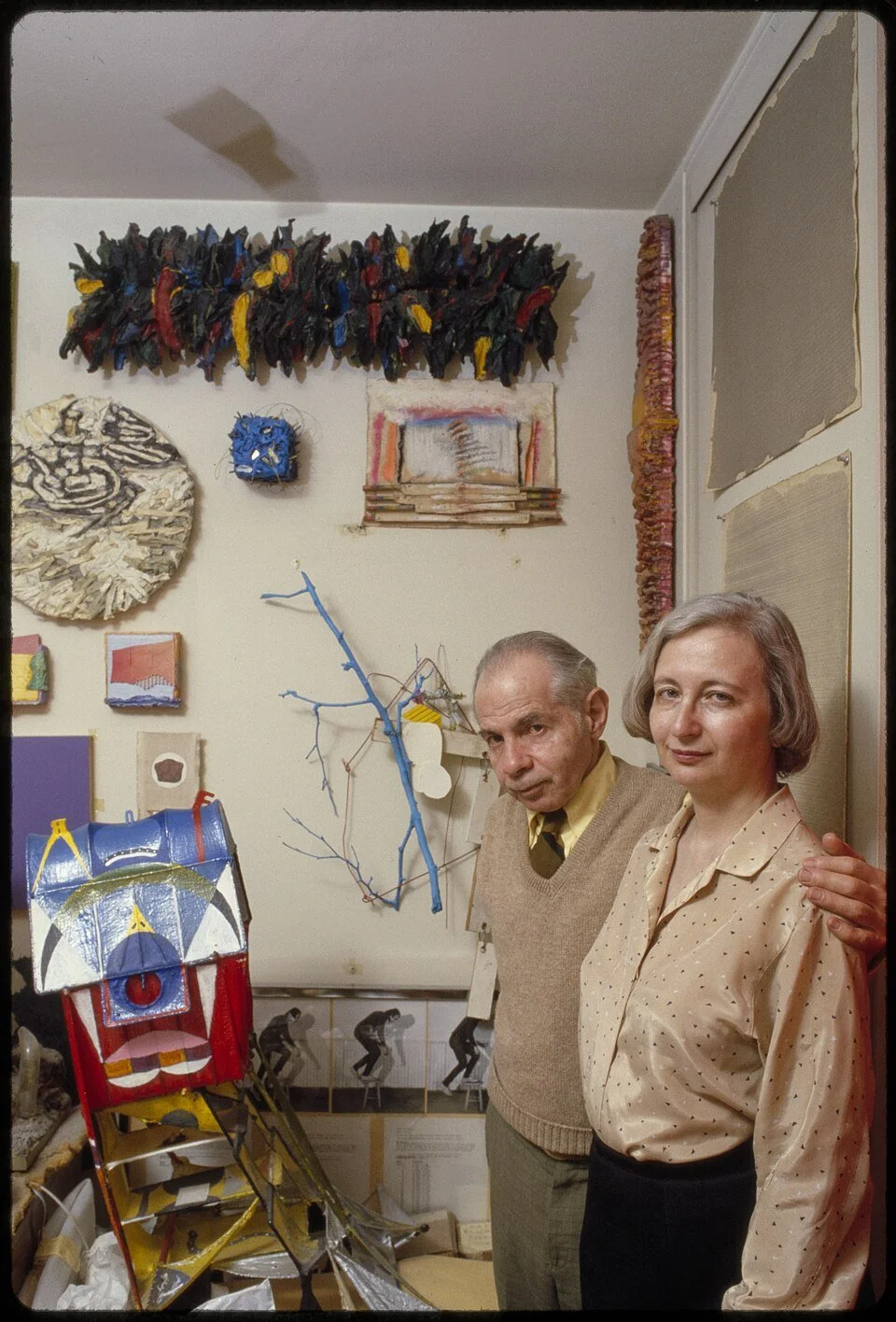 The art collectors Herbert and Dorothy Vogel standing in their apartment surrounded by art.