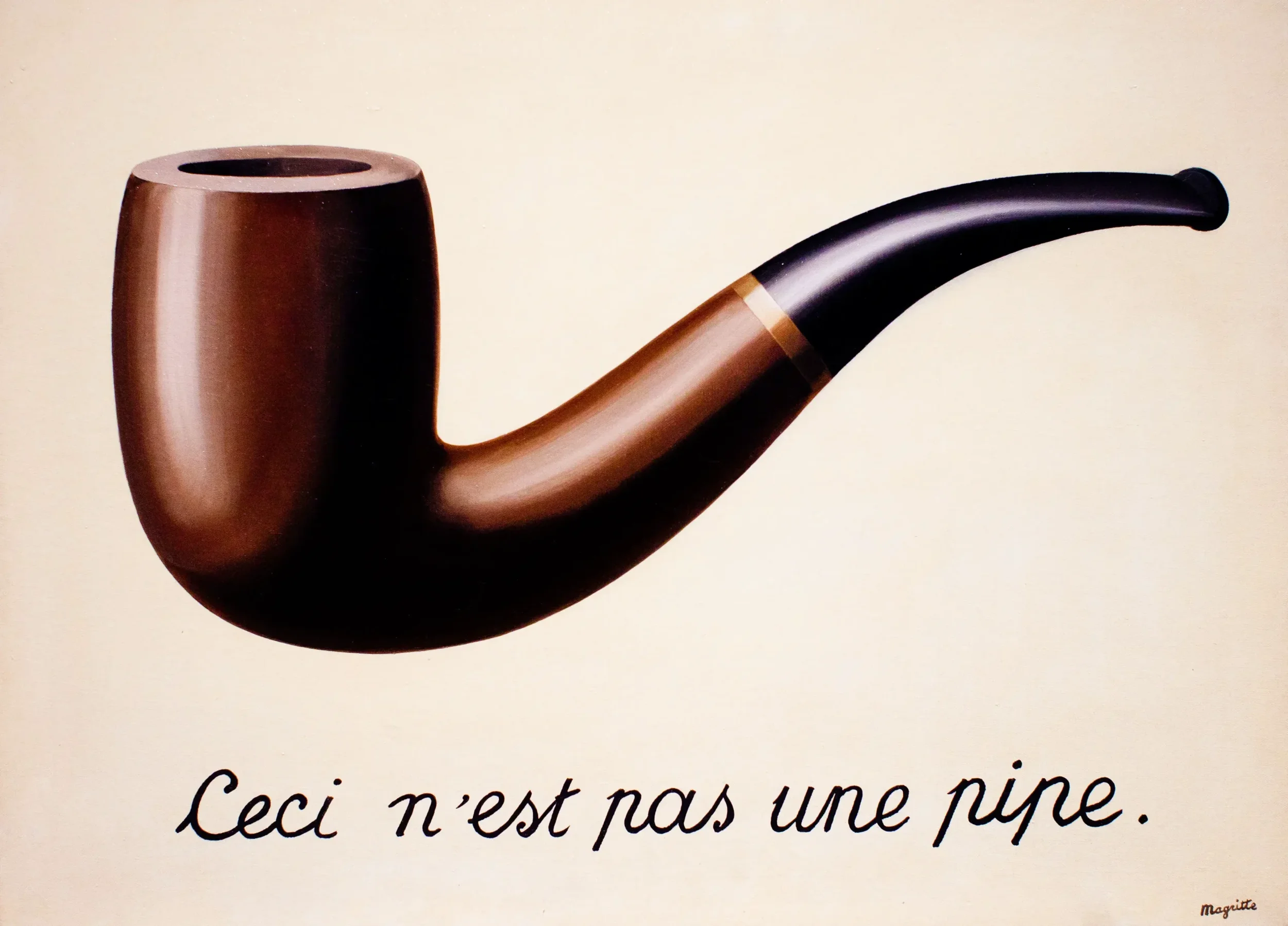 René Magritte’s The Treachery of Images, 1929: a painted tobacco pipe above the handwritten French phrase “Ceci n’est pas une pipe” (“This is not a pipe”).