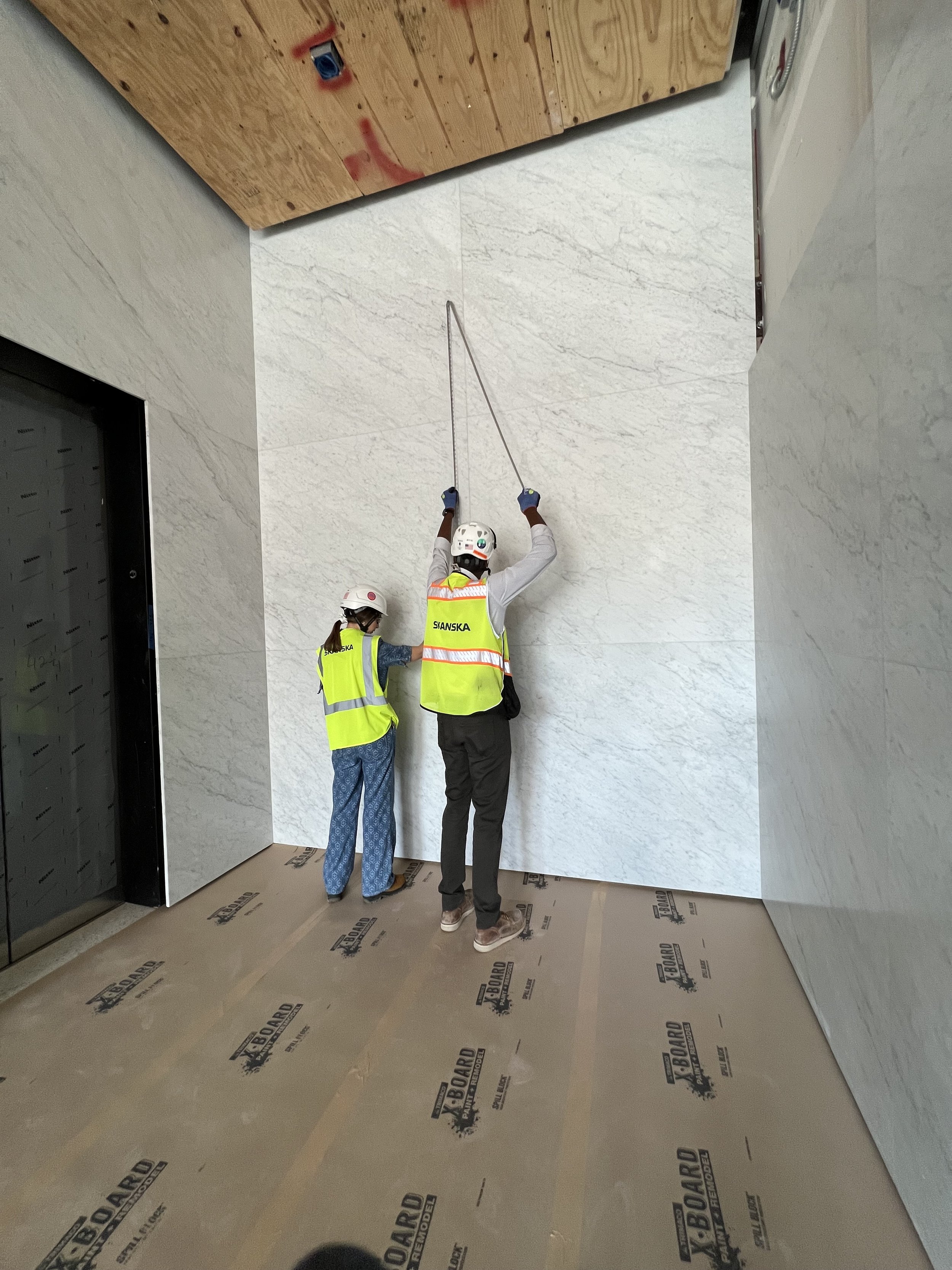 Measuring the space for my painting. 