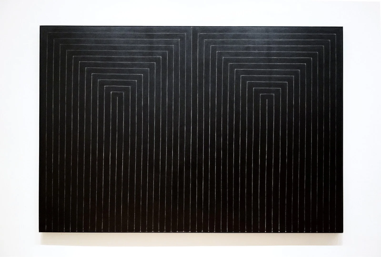 Frank Stella’s The Marriage of Reason and Squalor II, with symmetrical black enamel bands forming nested, angular U-shapes separated by narrow lines of exposed canvas.