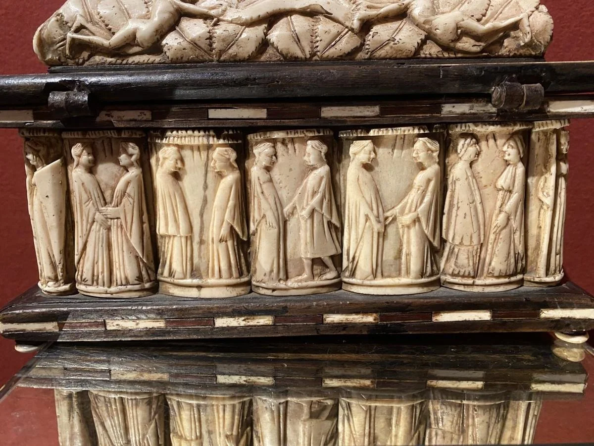 Fifteenth-century Italian wedding casket with elaborate carved and inlaid decoration, made to hold valuables, textiles, or other goods associated with marriage and a bride’s dowry.