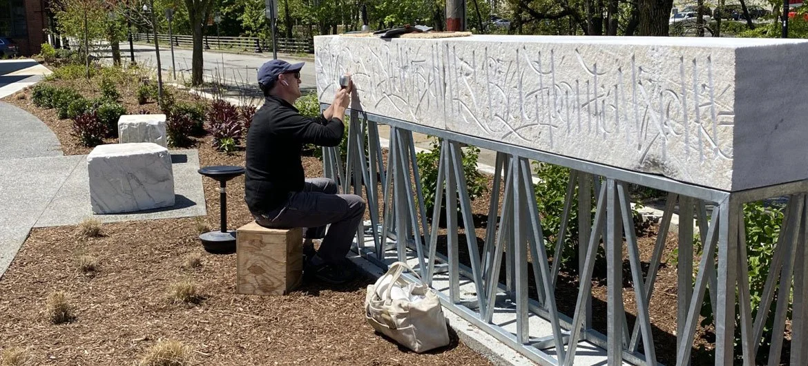 Nick Benson carving Base64 code into reclaimed marble for Farm Fresh Rhode Island