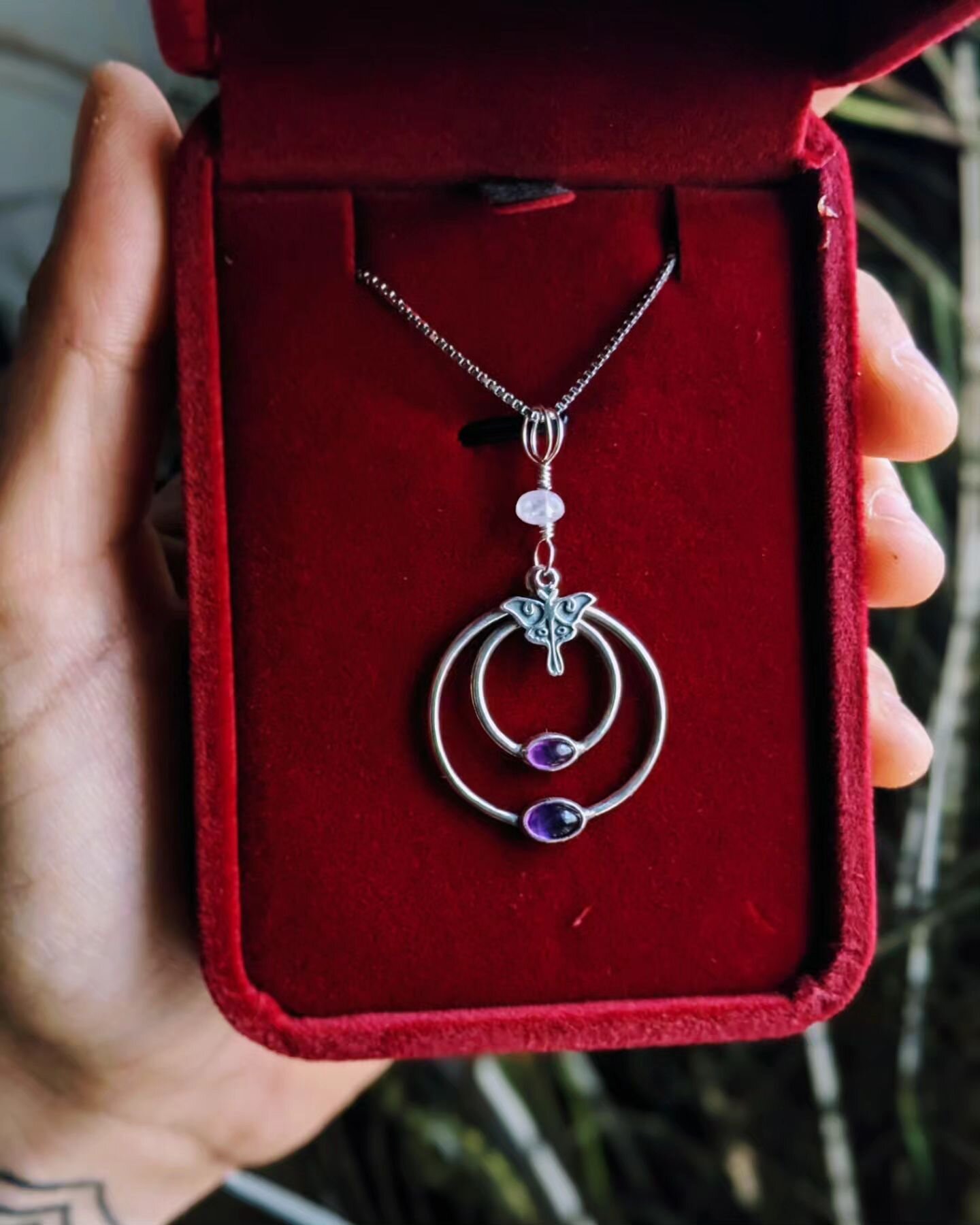 &quot;Nocturnal Orbicular&quot; necklace just dropped in the online shop! One-of-a-kind sterling silver pendant features a rainbow moonstone, two Amethysts and a tiny Luna moth! Total pendant height is 1.75&quot; tall including the bail. It comes on 