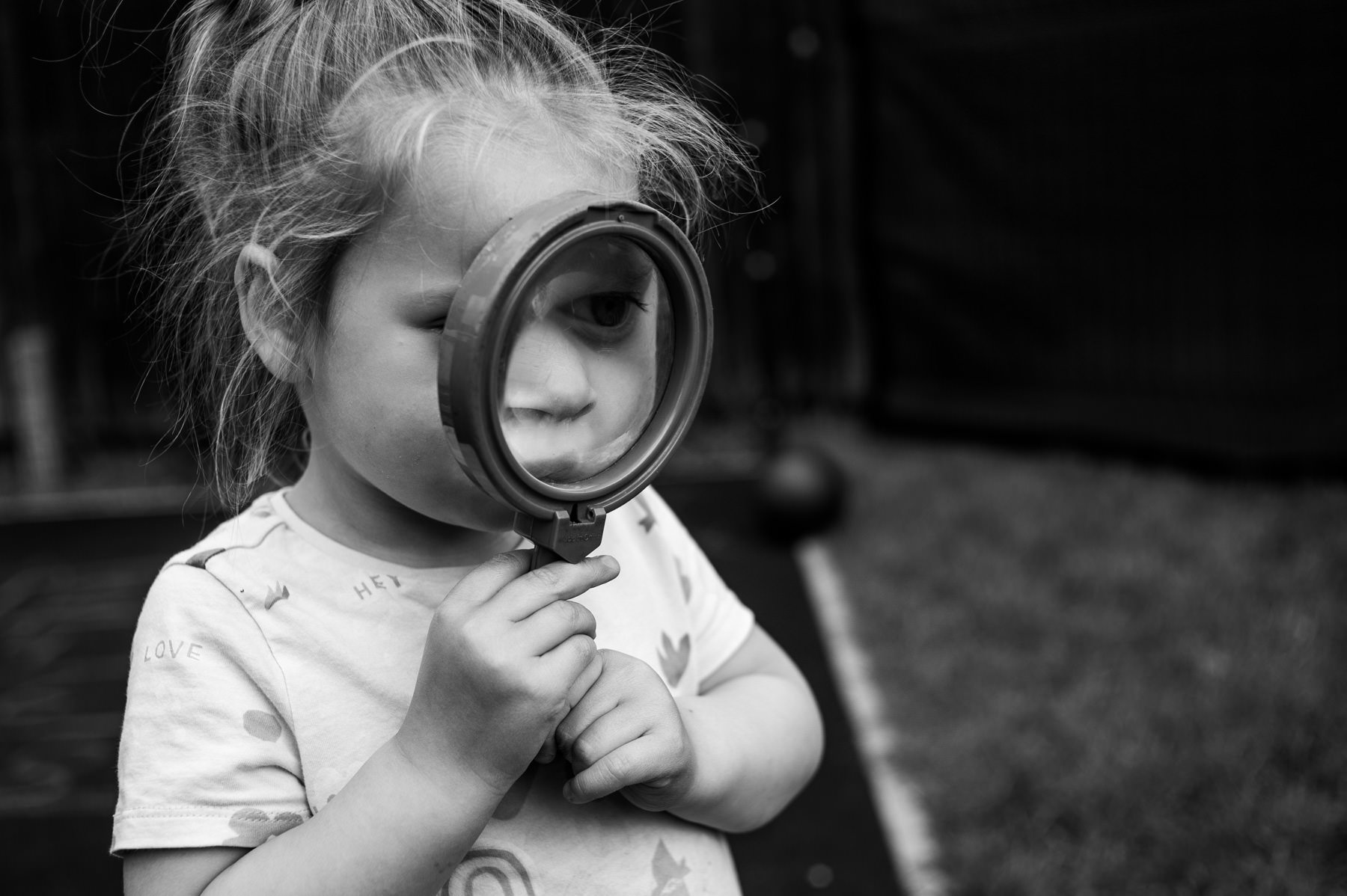 Child's-face-though-magnifying-glass