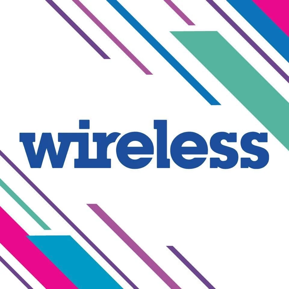The image features the word "wireless" in bold blue lowercase letters, surrounded by diagonal stripes in purple, teal, and pink on a white background.