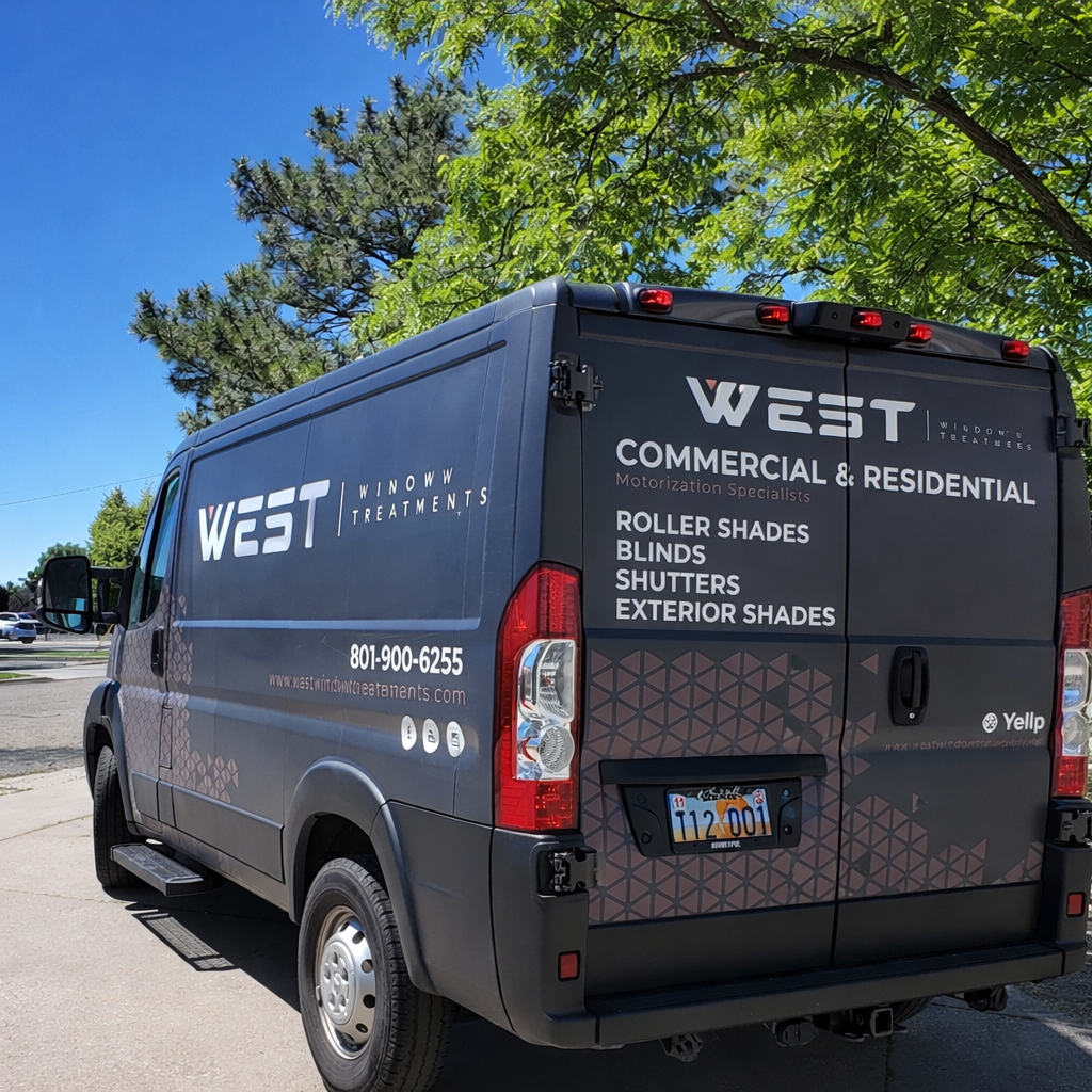 Gray commercial van with branding for WEST Treatments parked on a lot, under green trees with a clear blue sky in the background.