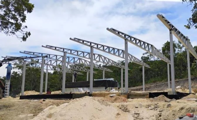 The steel frame of the Dhamma hall going up in 2025.