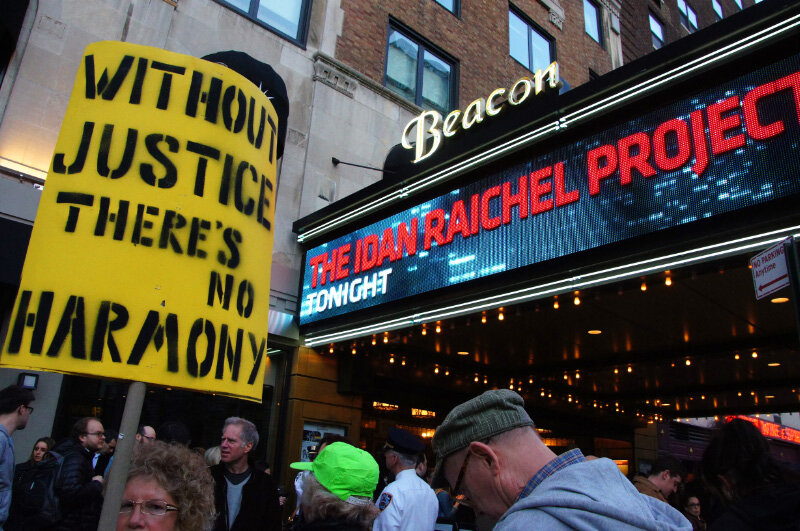  Protester with sign “Without justice there’s no harmony” in front of Beacon Theater with Idan Raichel Project on marqee 