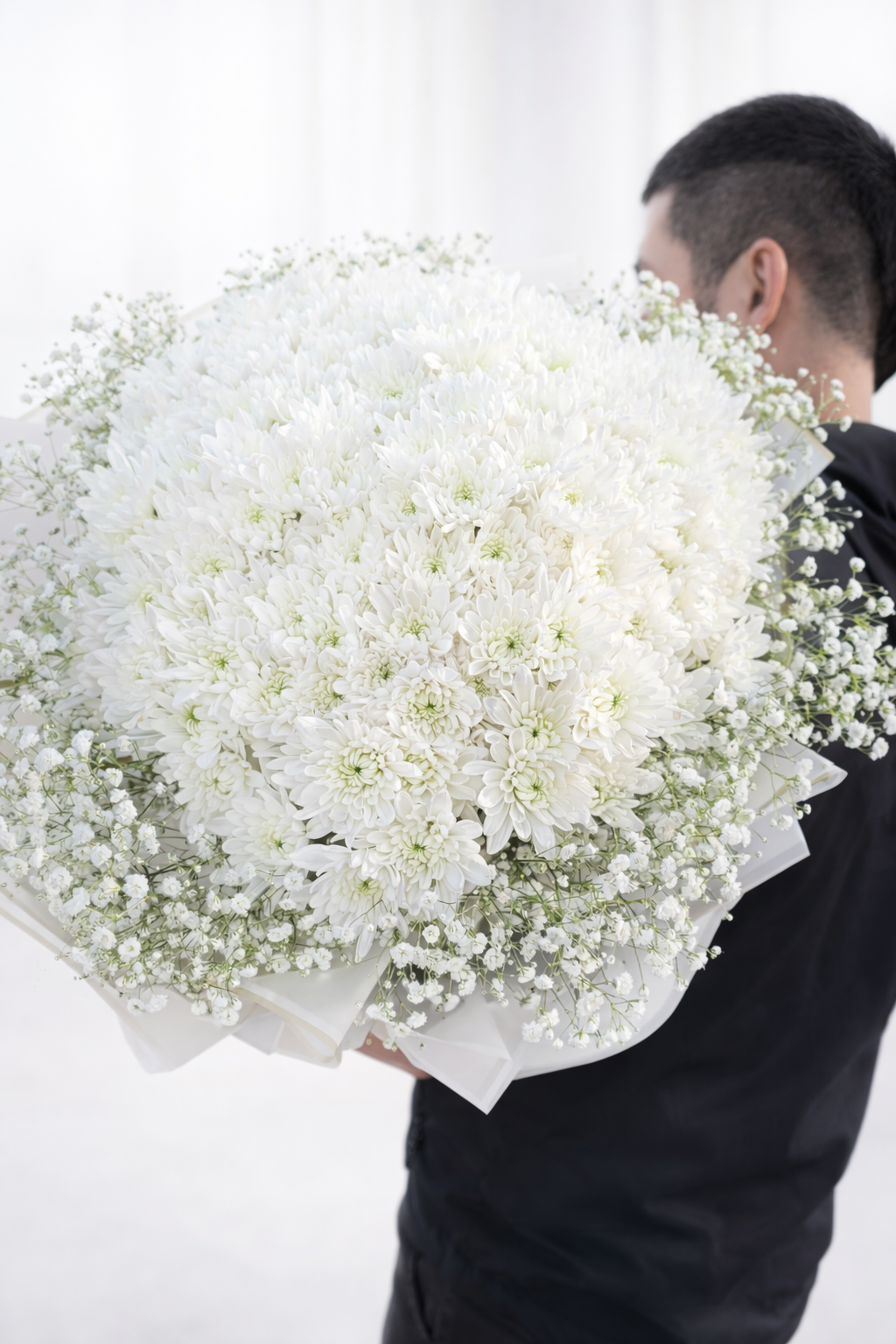 Elegant bouquet of white chrysanthemums.png