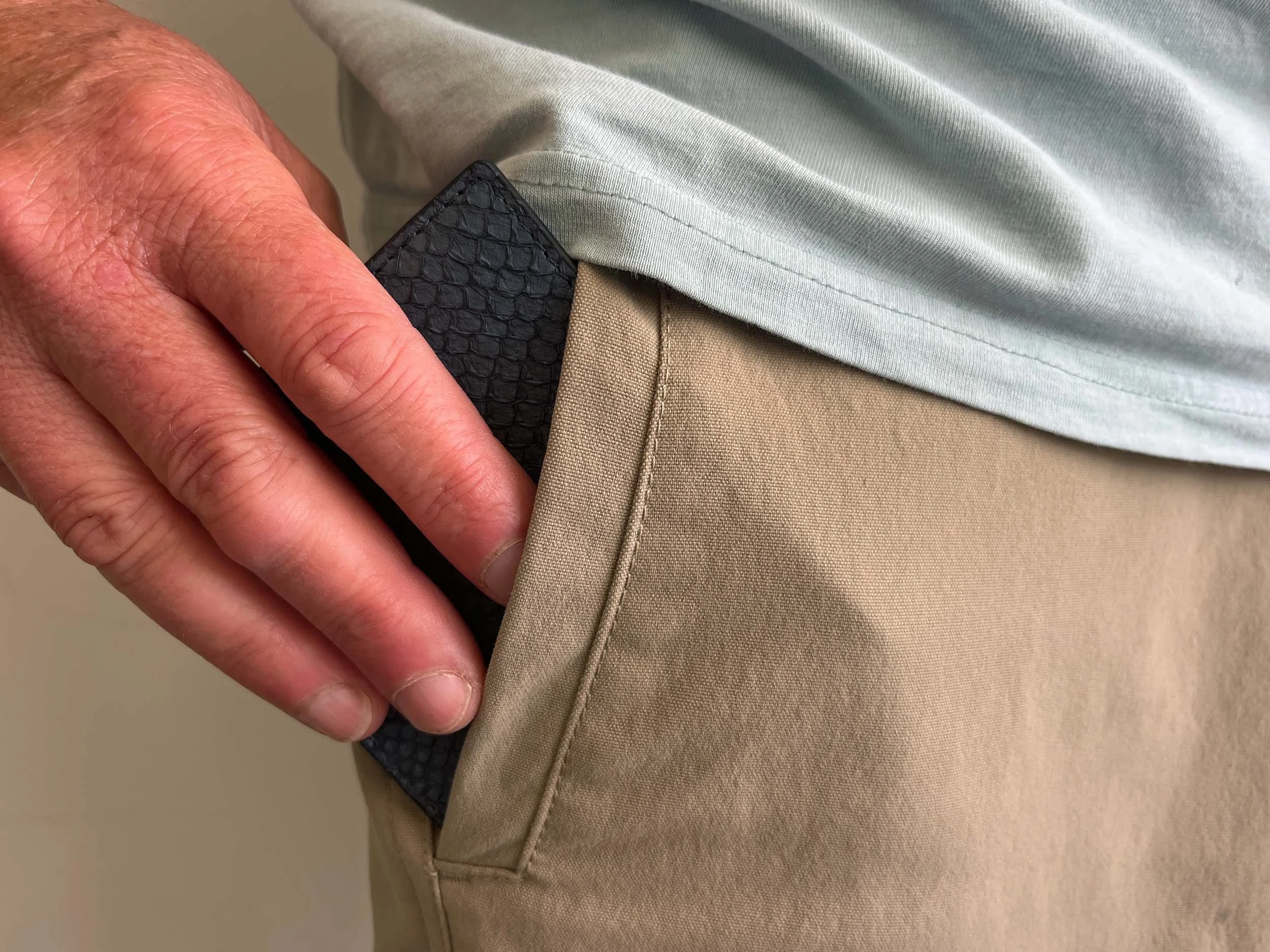 Jeff removing the Ofishal wallet from his pocket
