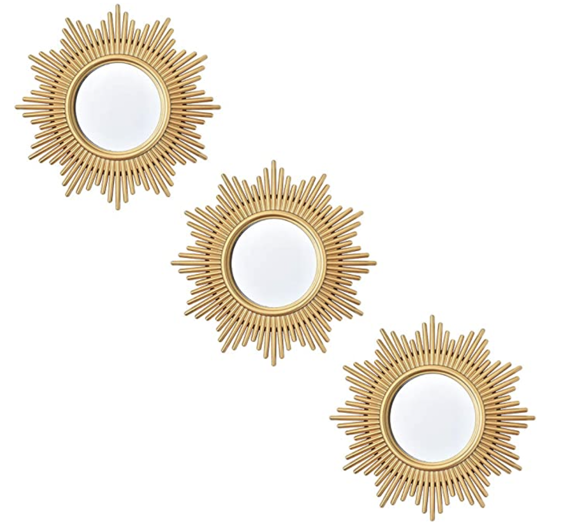Three small decorative wall mirrors in gold