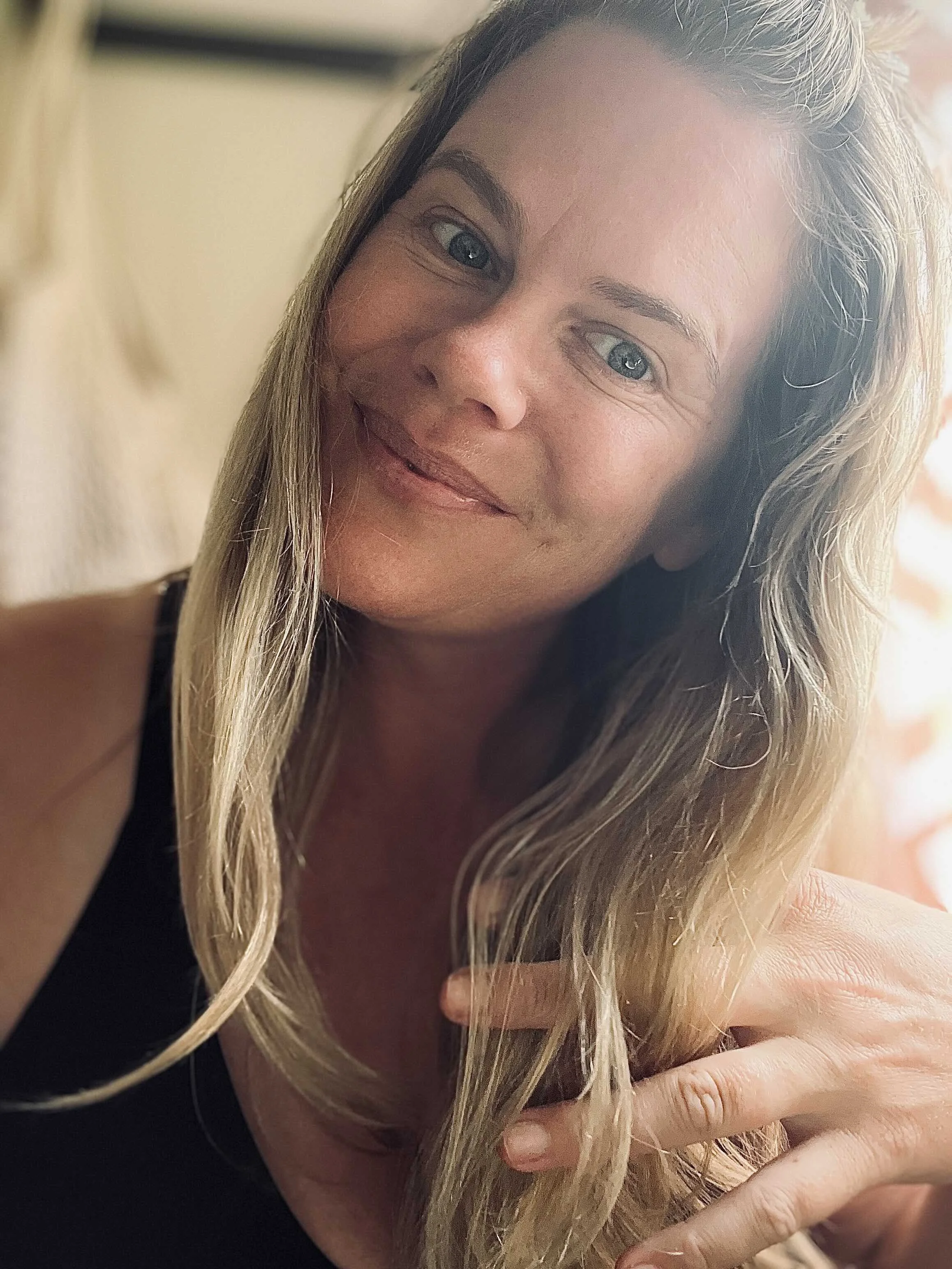 Tara Cooney works the serum through her hair