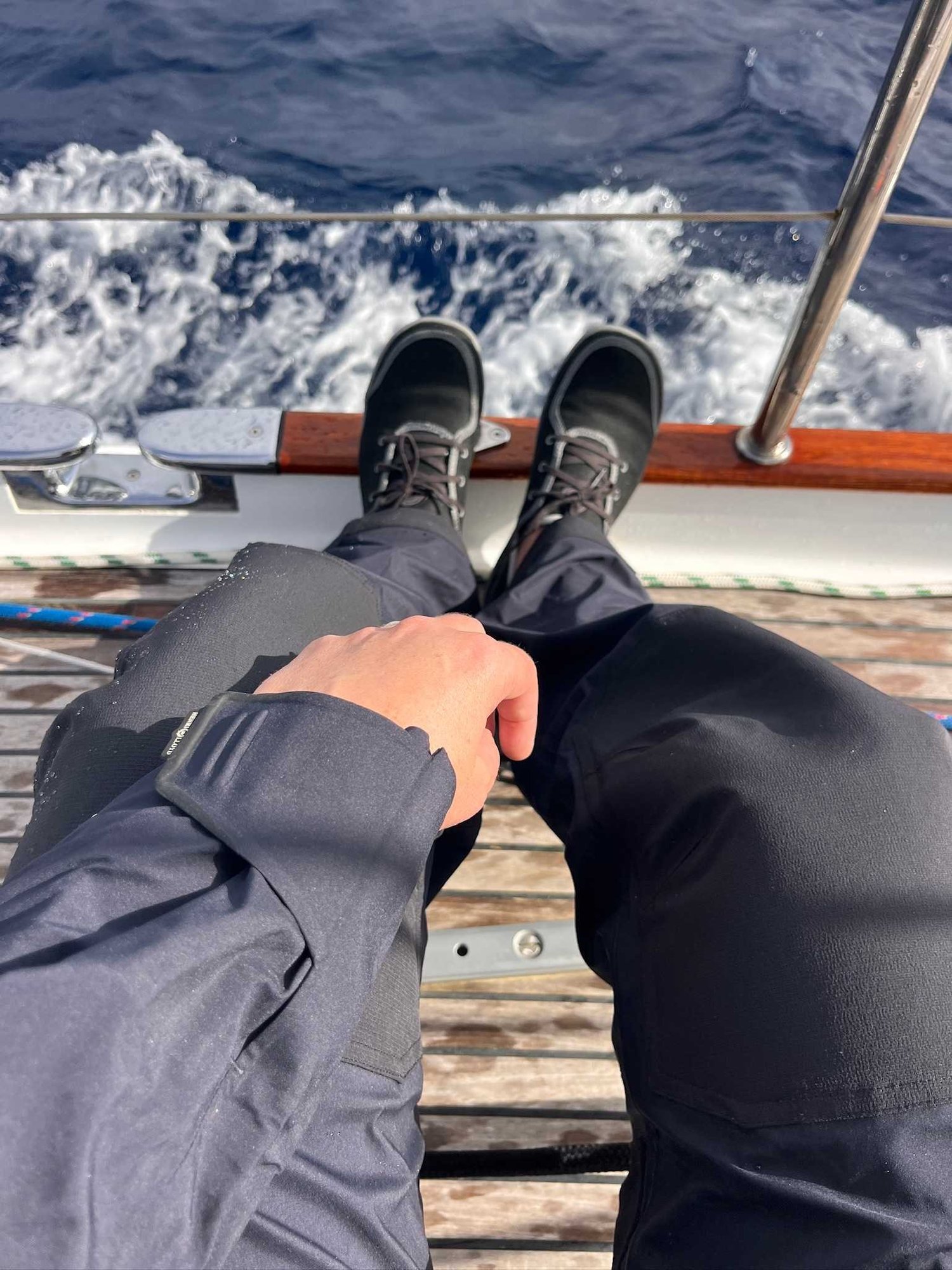 Astral Loyak EZ HT sailing shoes worn on a yacht deck