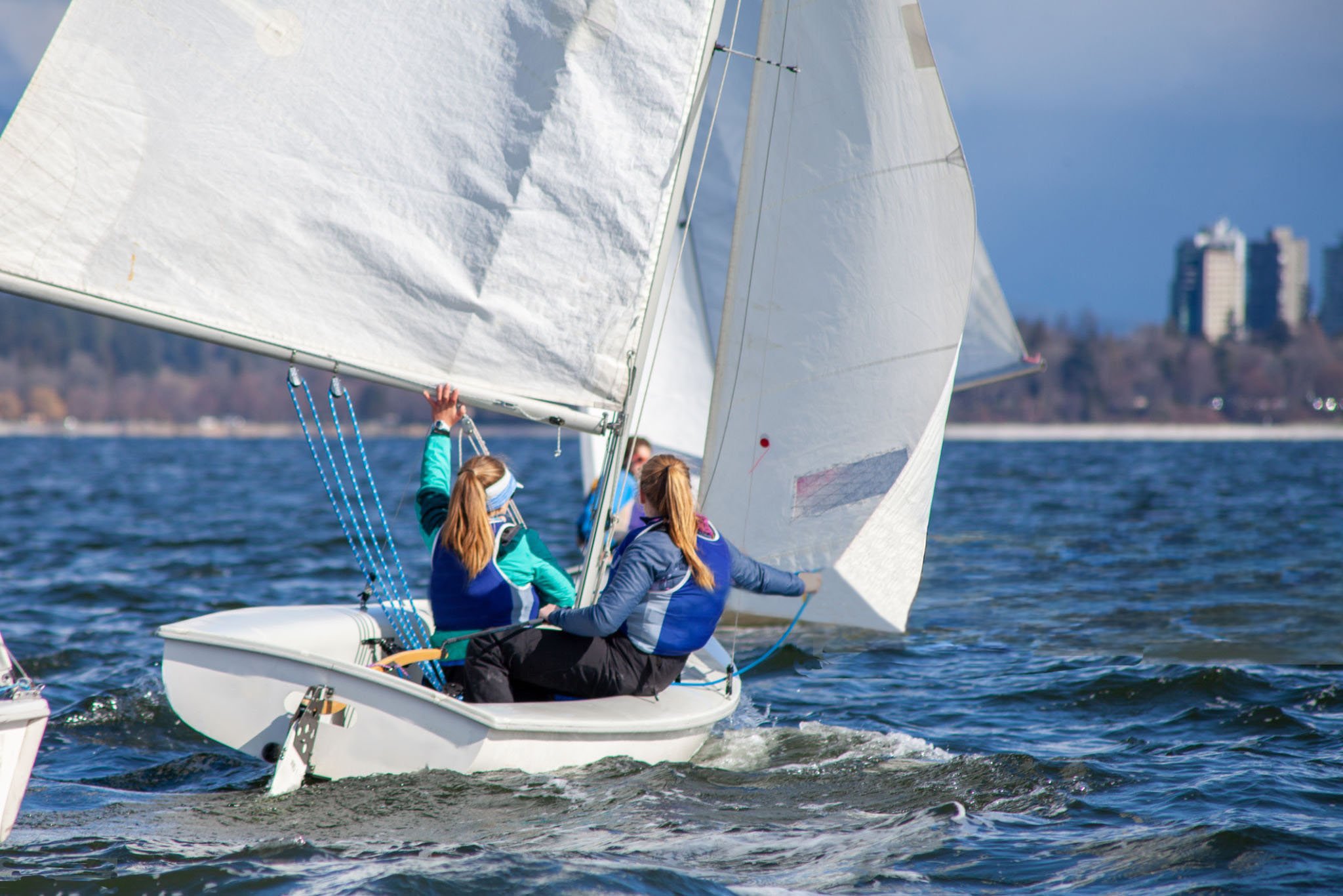 Women sailing small boats in a regatta