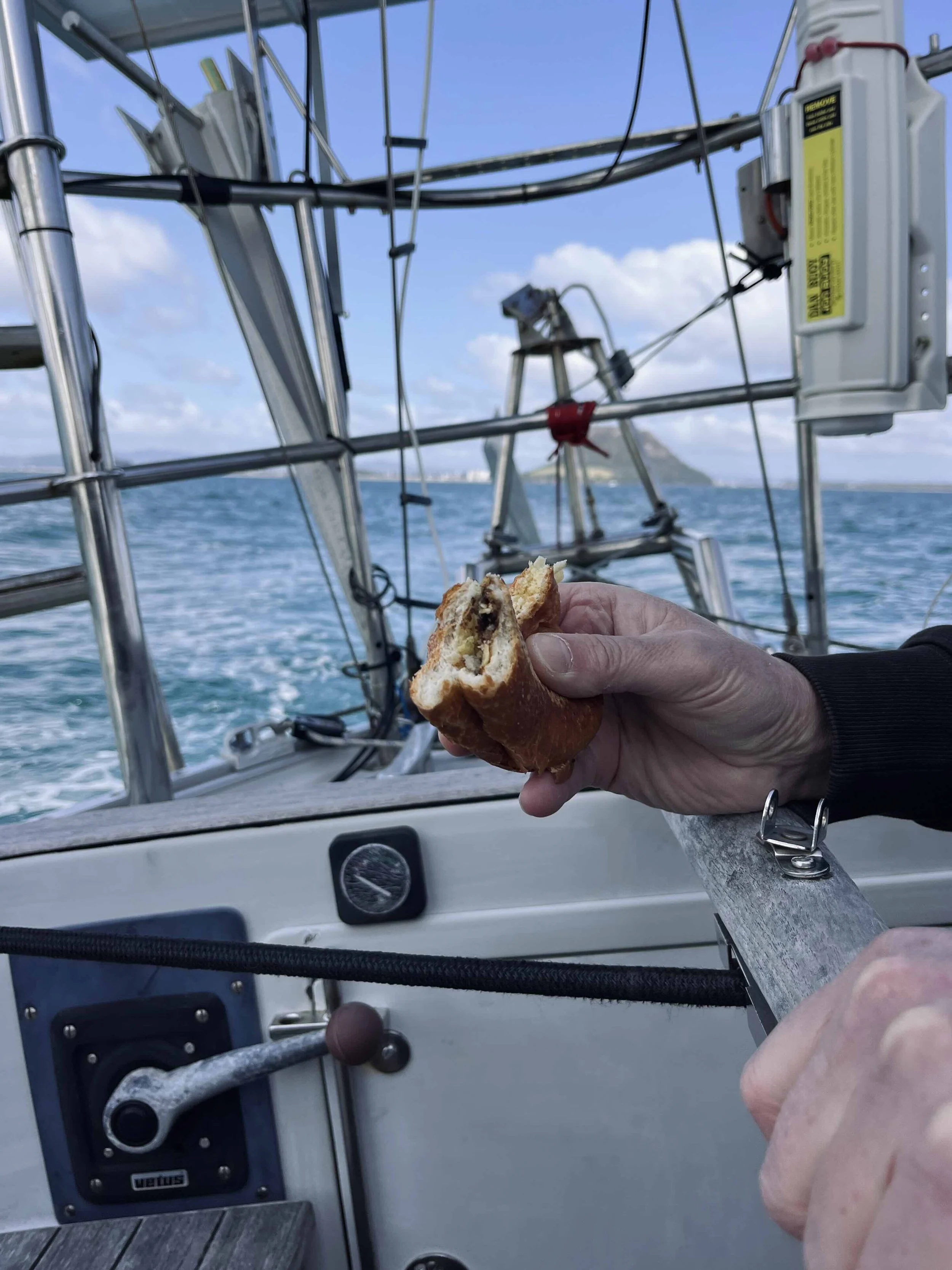 Salt & Vinegar chips in a white roll while sailing