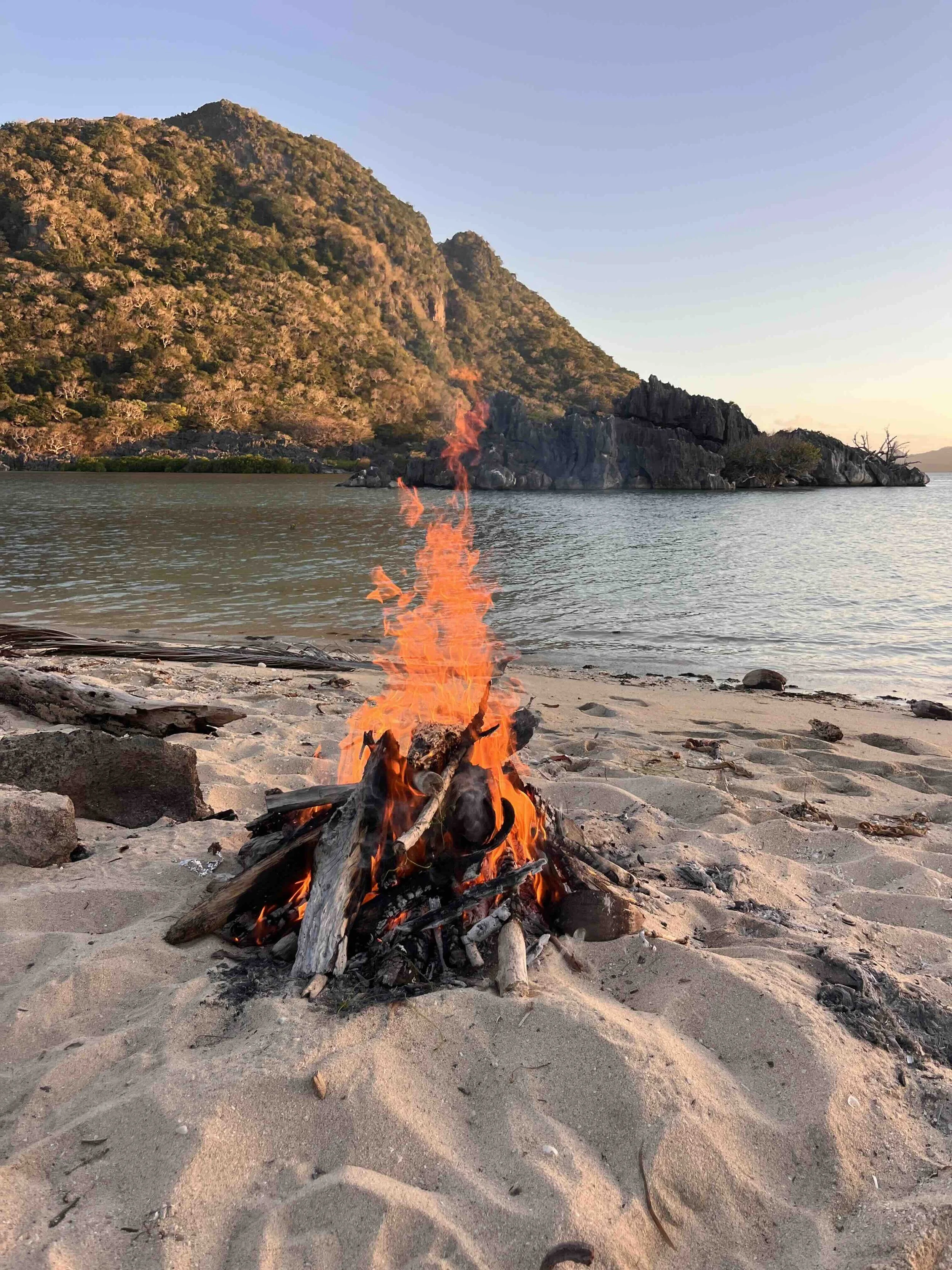 Beach fire at sunset in the Yasawa Islands, Fiji