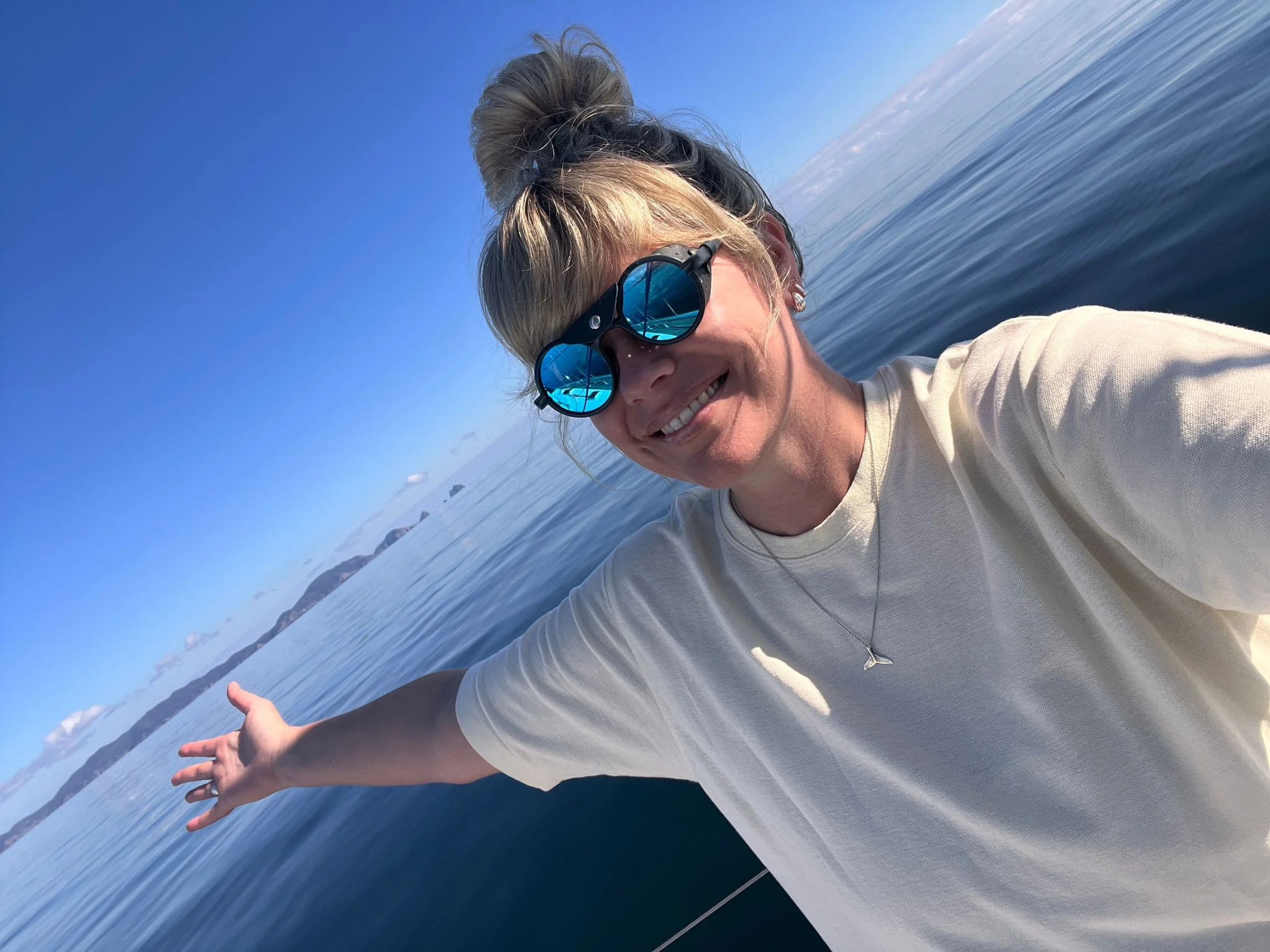 Tara Cooney, Editor wearing the Vallon Heron glasses on a calm sailing day