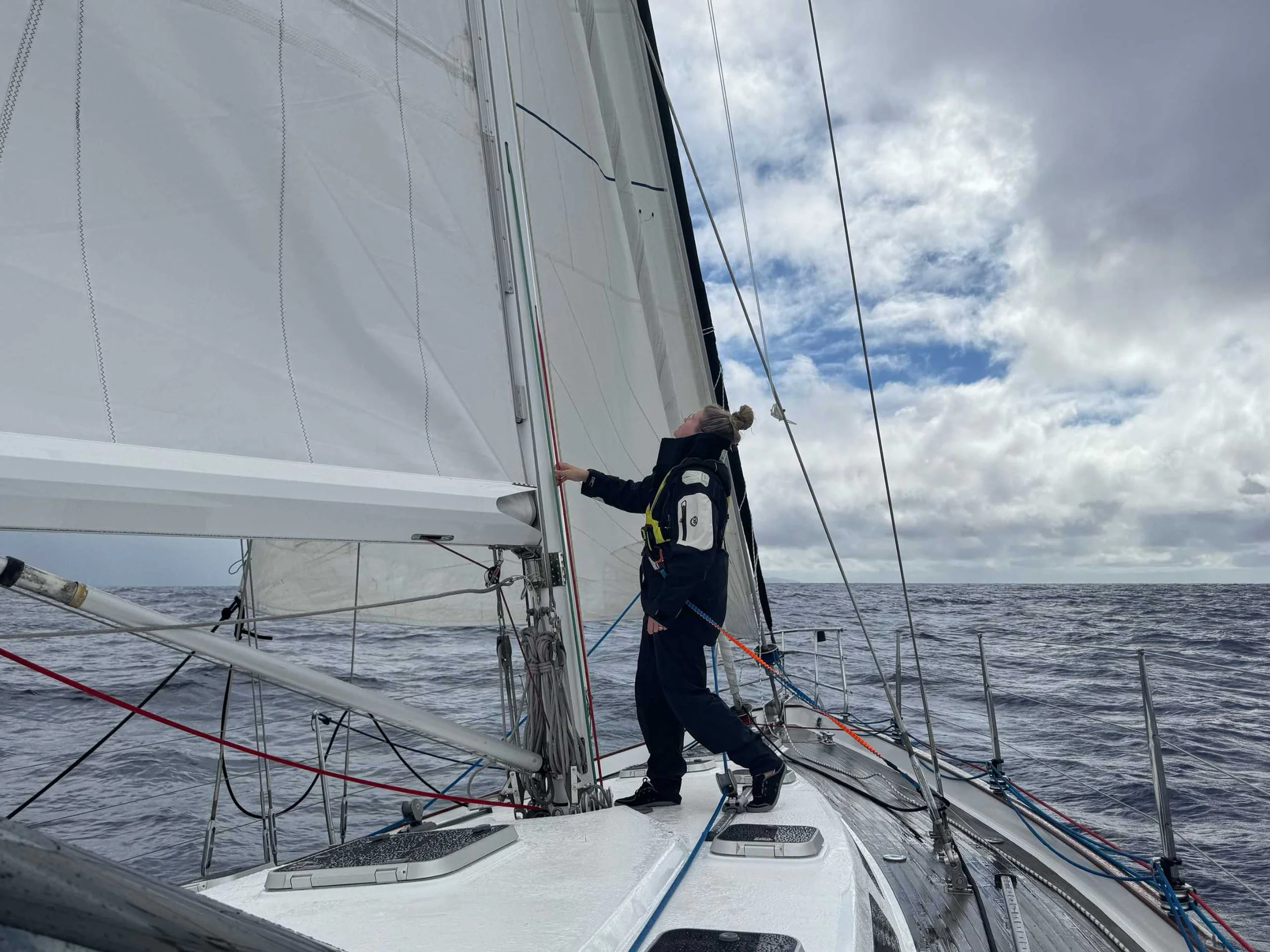 On deck off shore in the Astral Loyak EZ HT shoes and wet weather gear