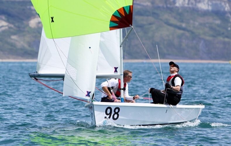 Two sailors in a Hartley Wayfarer sailboat