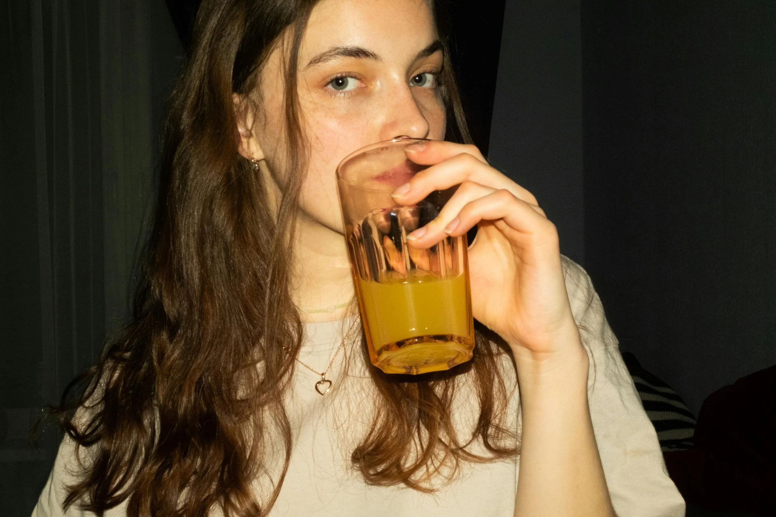 young woman drinking juice