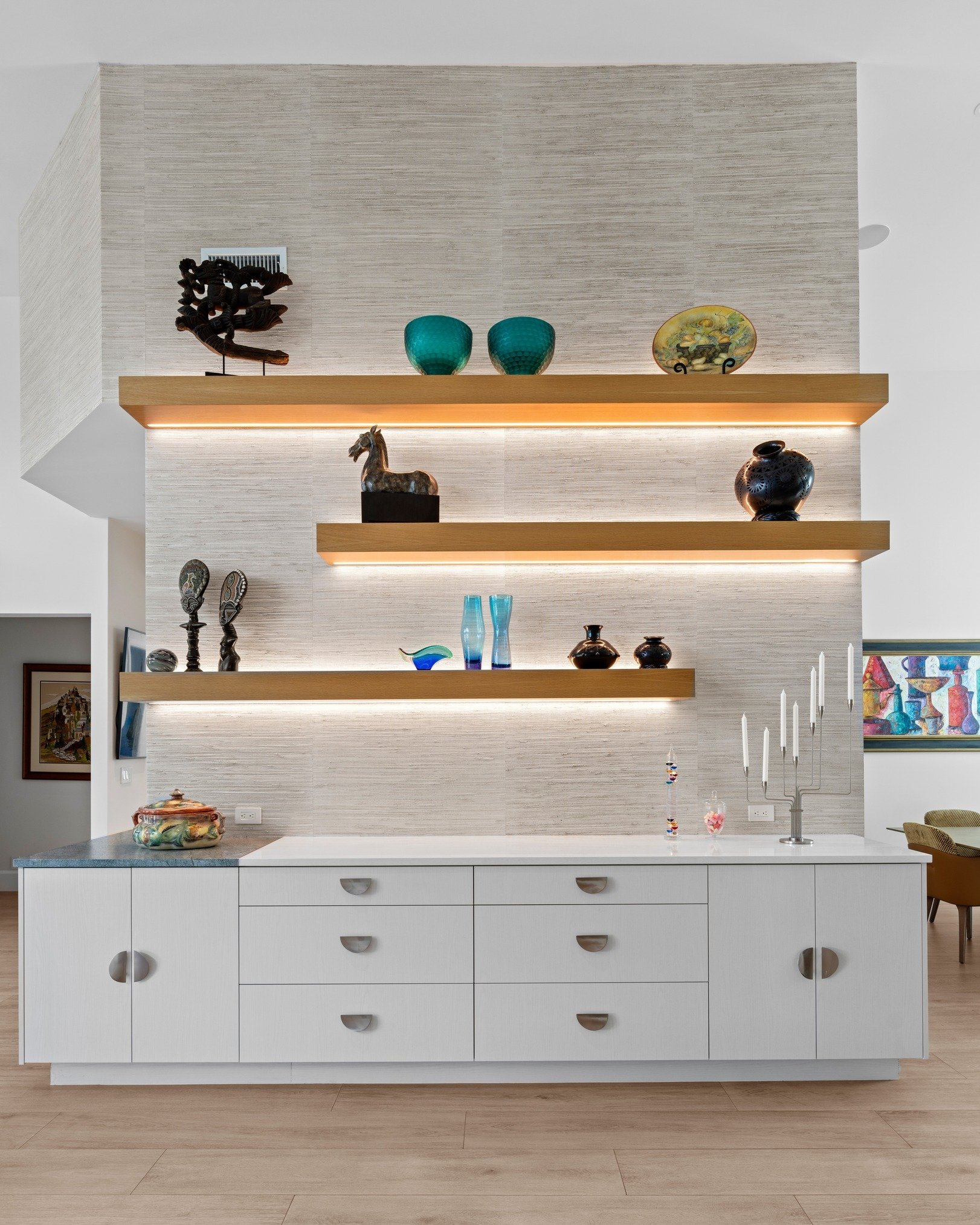 Where function meets form - a beautiful built-in storage unit dividing the different sections of this great room. 

 #madebynmb #customhome #customhomes #walld&eacute;cor #walldecorative #customcabinetry #customcabinetrydesign #dreamhome #dreamhomes 