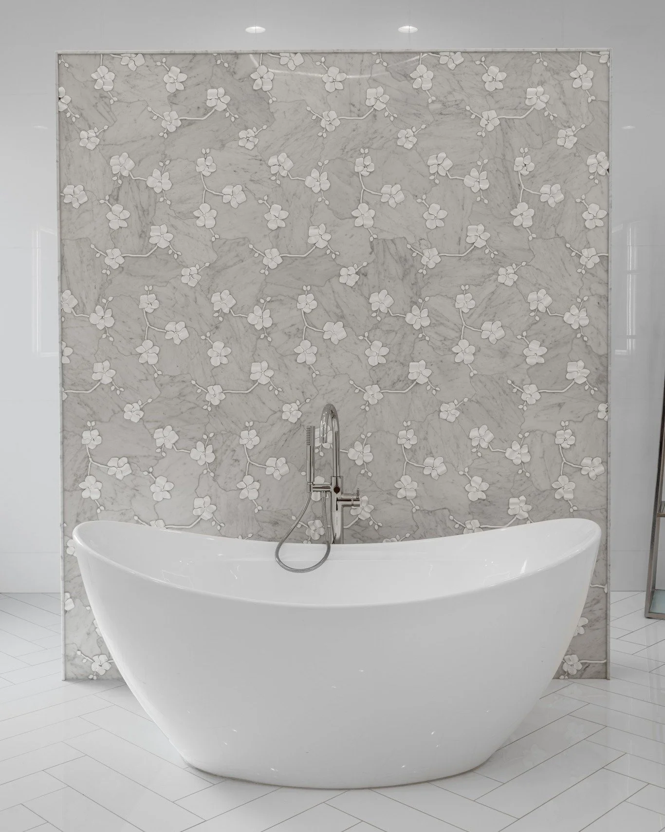 Consider this our official "do not disturb" zone! 

From the hand-carved marble flowers to the handles on the faucet, this magnificent and serene bathroom is proof that the small details are really the star of the show. 

 #madebynmb #bathr