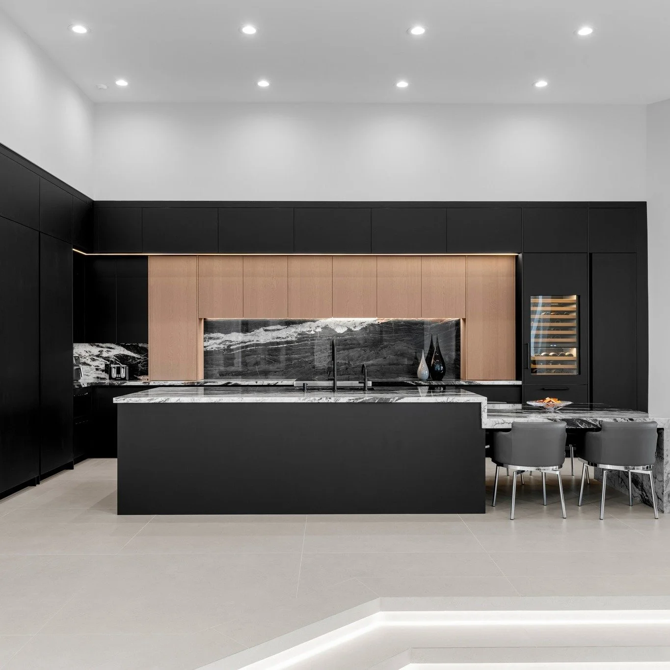 ✨Your dream kitchen belongs on a lighted pedestal!✨

This jaw-dropping kitchen was curated with flawlessly integrated appliances and bold details. Anchored by the expansive eat-in island, this kitchen is more than a place to cook - it's the heartbeat