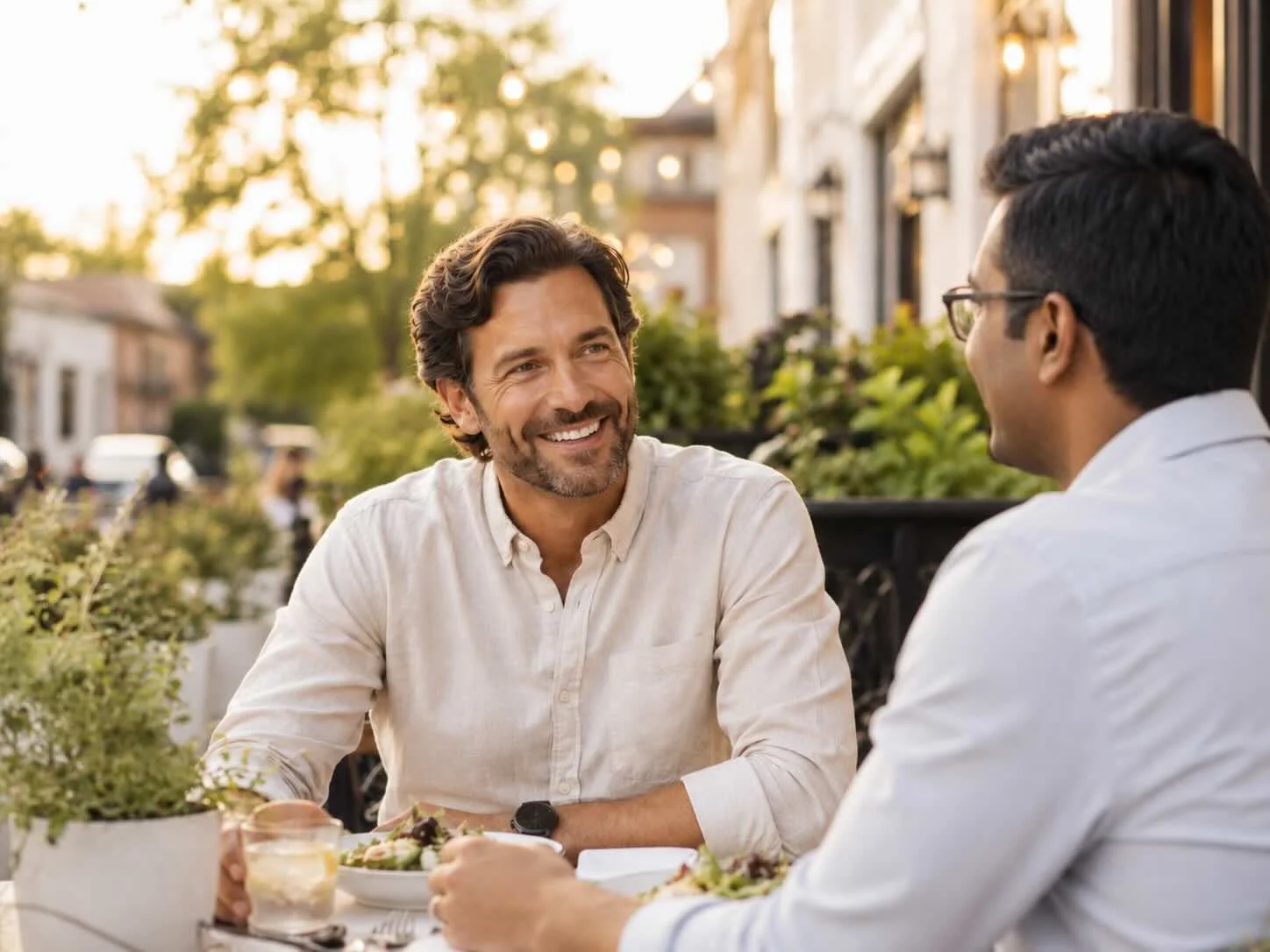 Photo of two professional men having coffee in the KC Metro Area representing the freedom that happens when you overcome social anxiety.