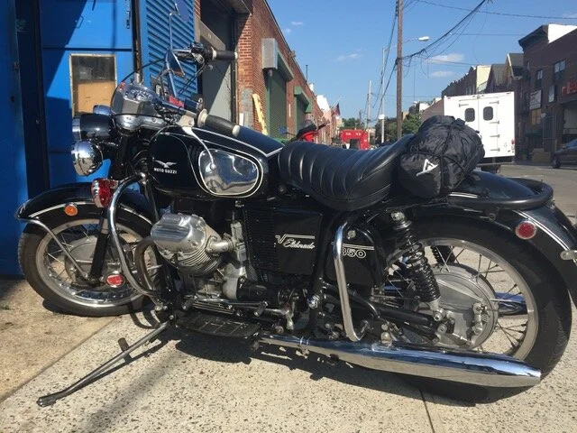 A restored vintage Moto Guzzi motorcycle