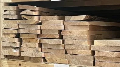 Stack of reclaimed Allen Ash boards from Mr. Allen’s inventory, rescued and ready to be crafted into new pieces.