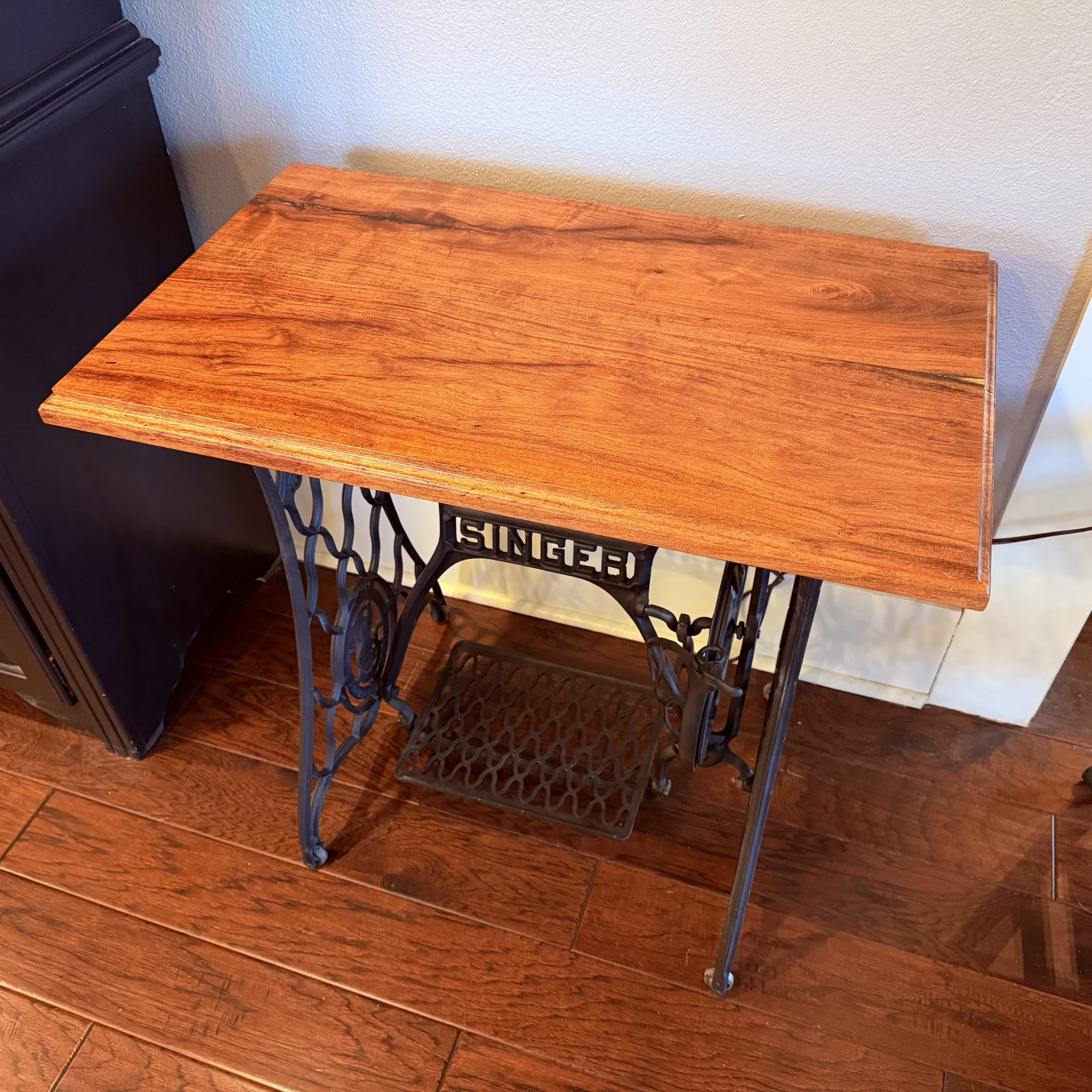 Full view of Singer treadle lamp table with Medina Mesquite top and restored sewing machine base