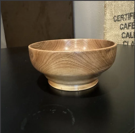 Hand-turned cherry bowl made from Mr. Allen’s reclaimed boards, smooth curved form with warm grain and satin finish.