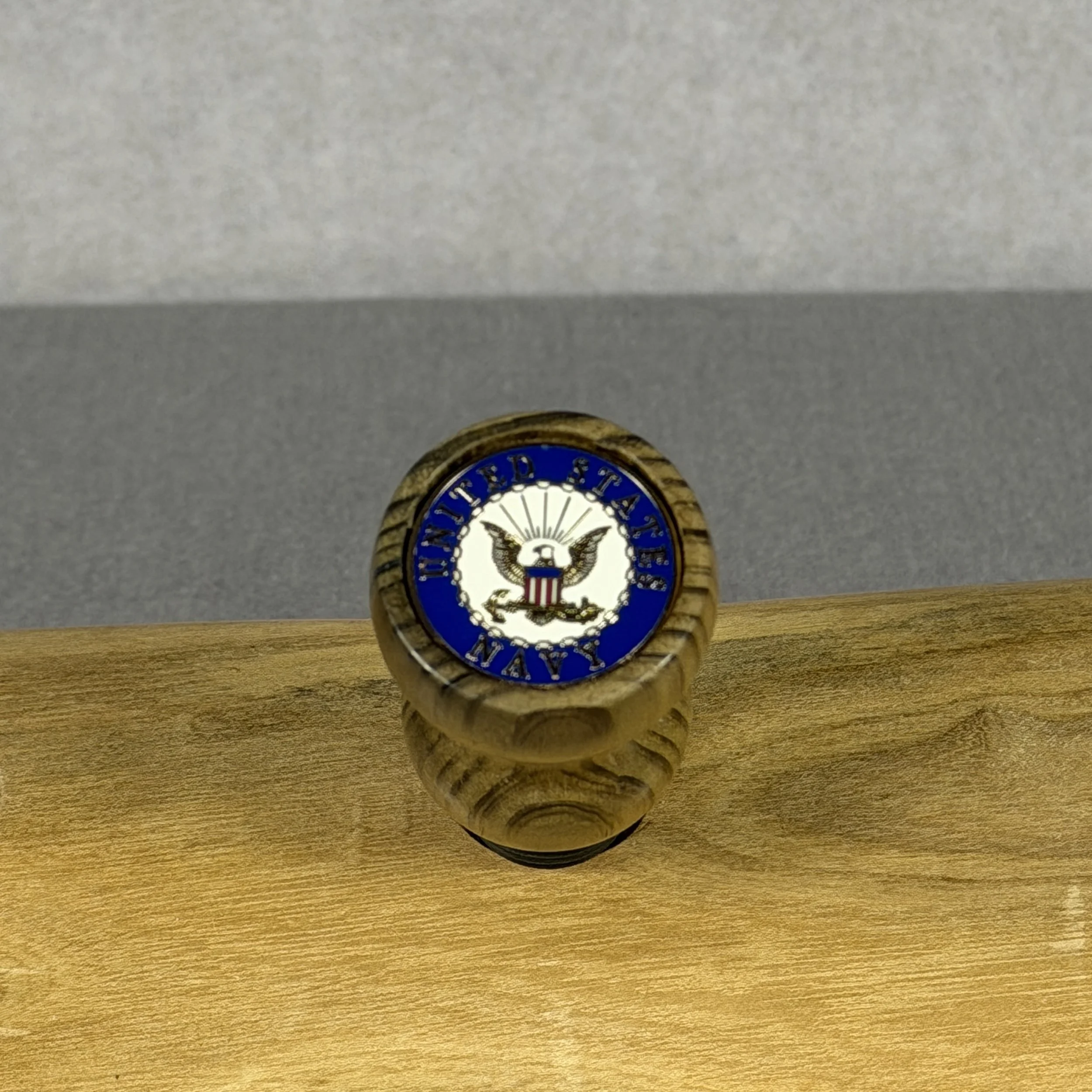 Top view of USS Texas reclaimed deck wood wine topper showing the inlaid United States Navy emblem
