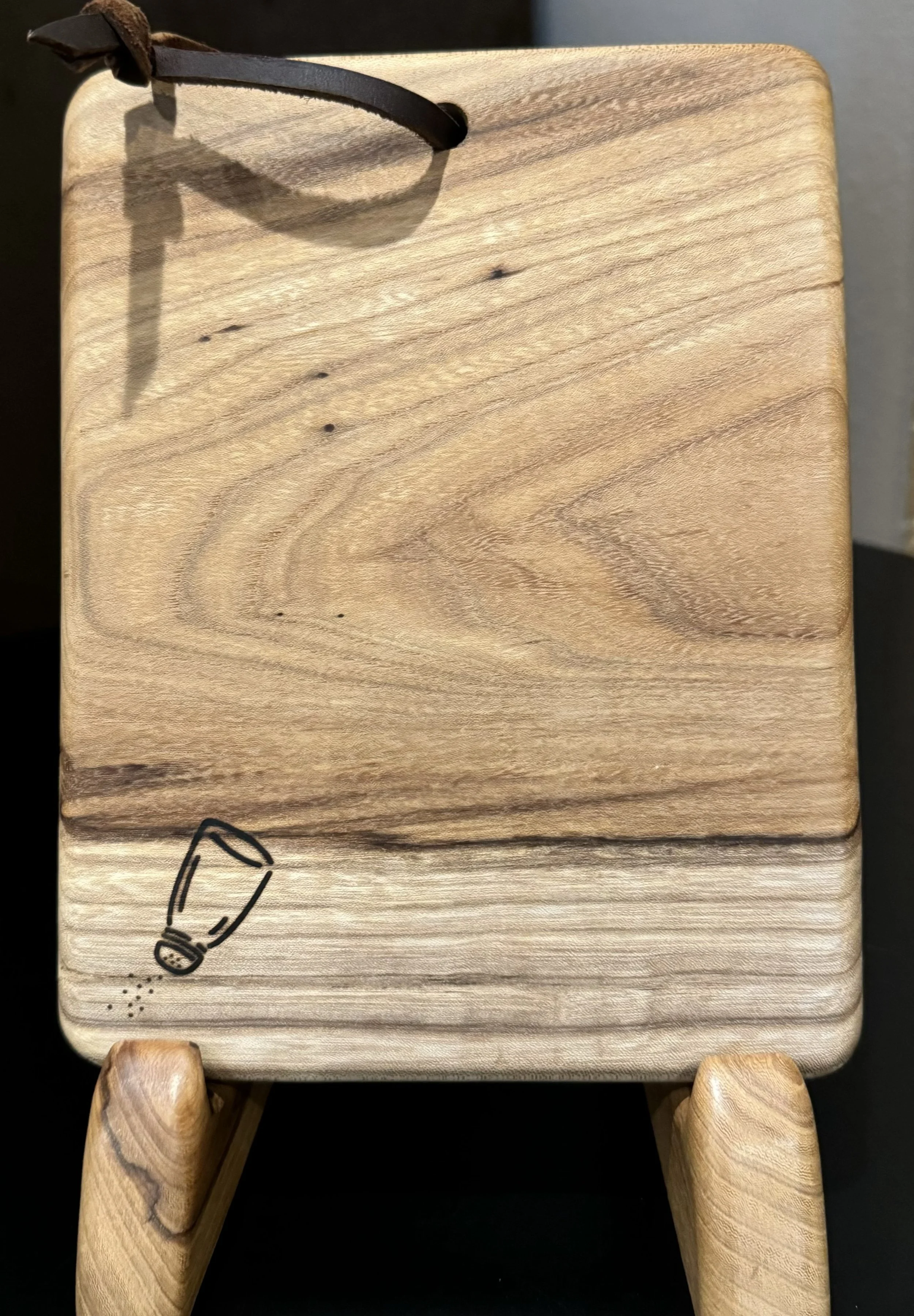 Reclaimed Allen American Elm cheese board with leather strap and hidden magnets to hold a small knife.