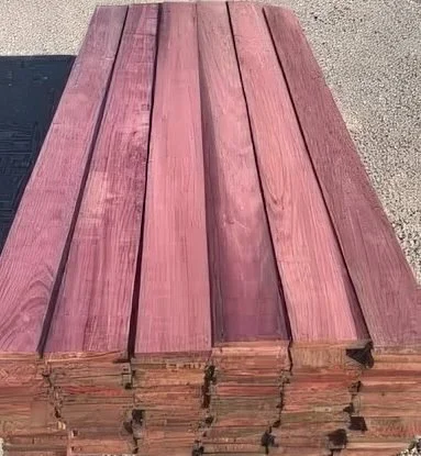 Stack of long Purpleheart boards from Mr. Allen’s shop, showing vivid natural purple color.