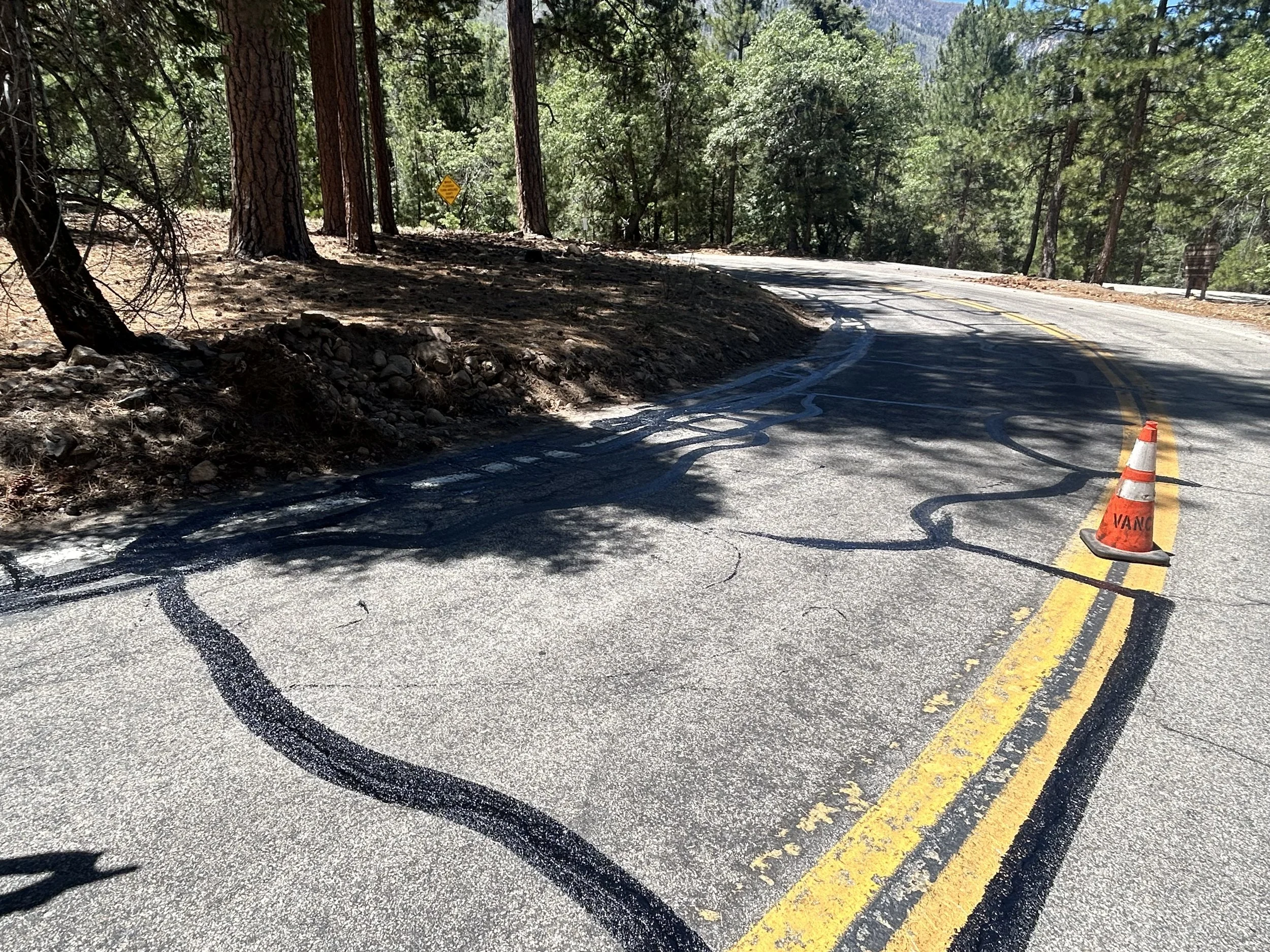 cracks on the road have fresh asphalt tar repair.